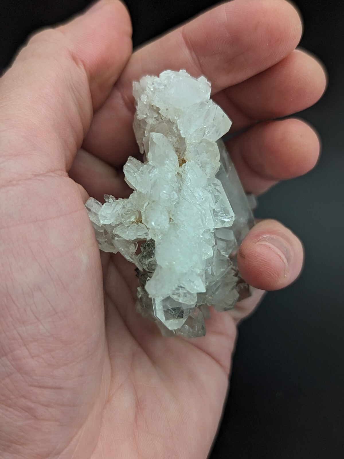 A translucent, pale blue crystal cluster with sharp, faceted edges and a natural, irregular growth pattern.