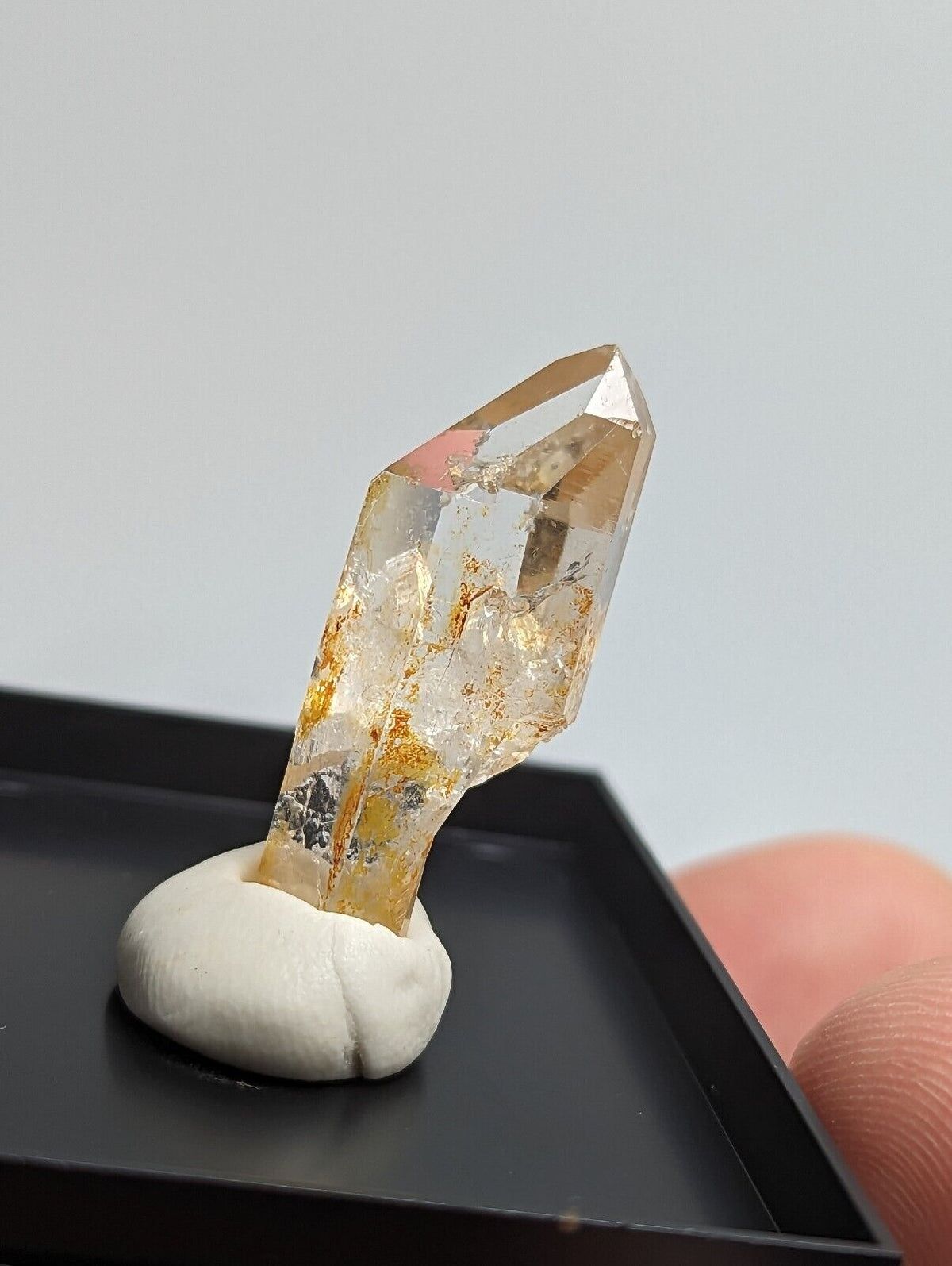 Translucent quartz crystal with golden inclusions.