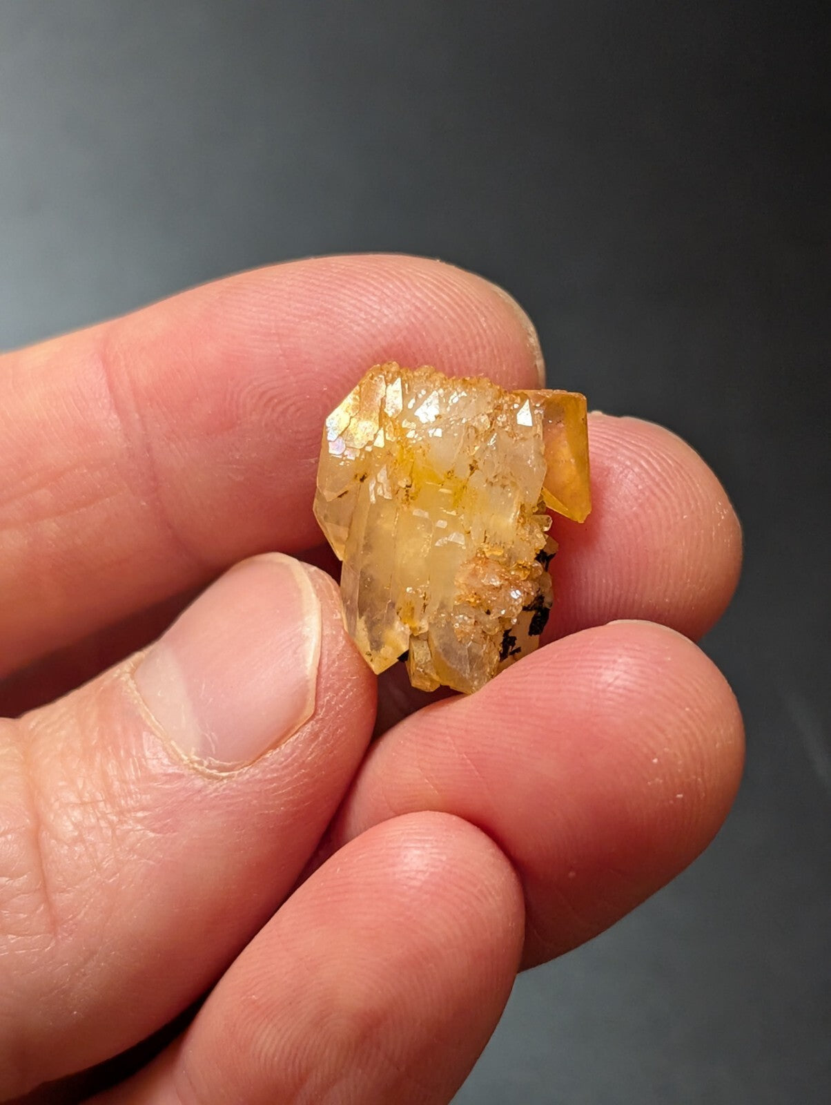 A translucent yellow crystal cluster with sharp, faceted edges and a slightly cloudy interior.