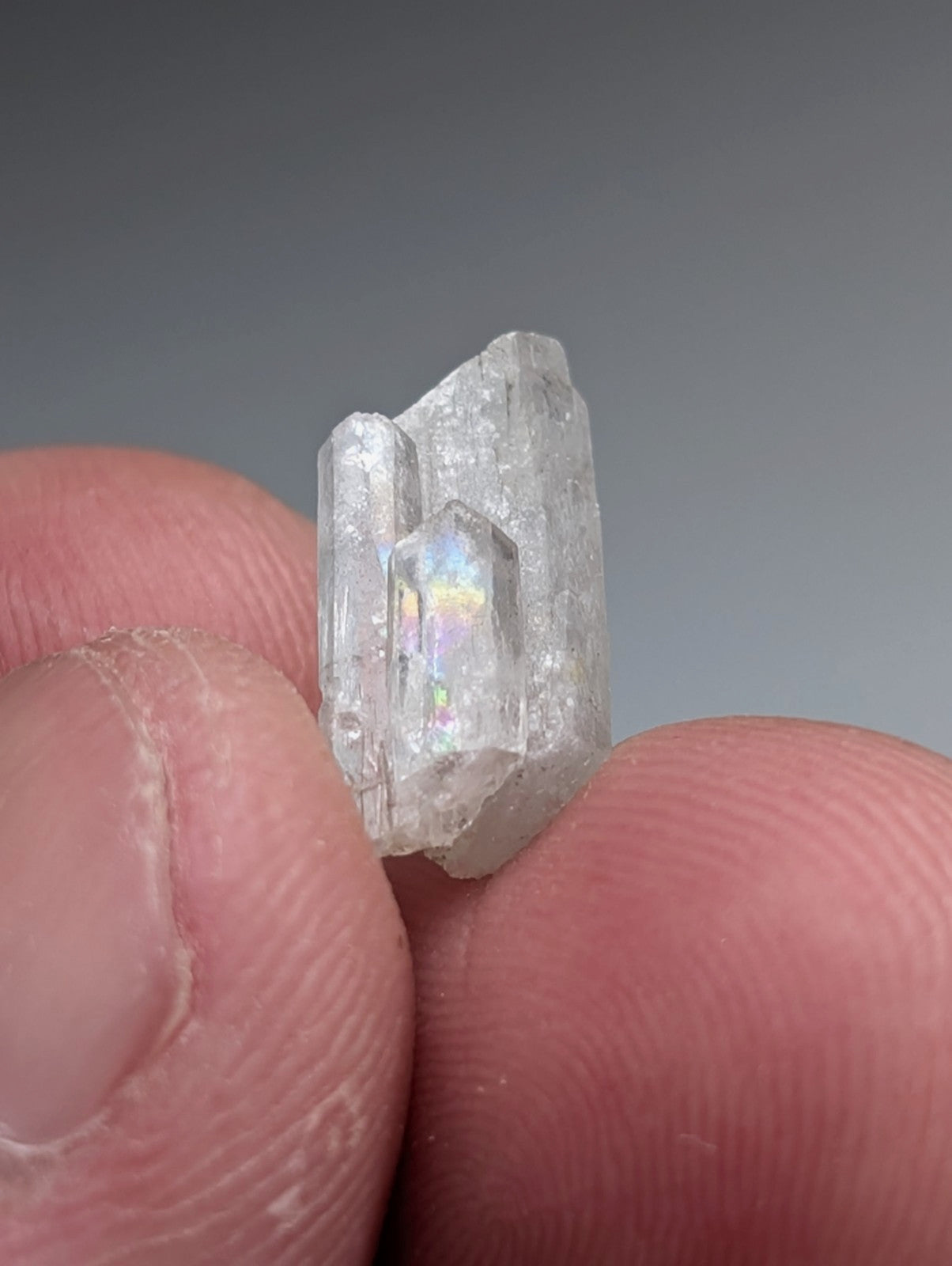 A clear translucent quartz crystal with faceted center and jagged edges from magnet cove arkansas with case