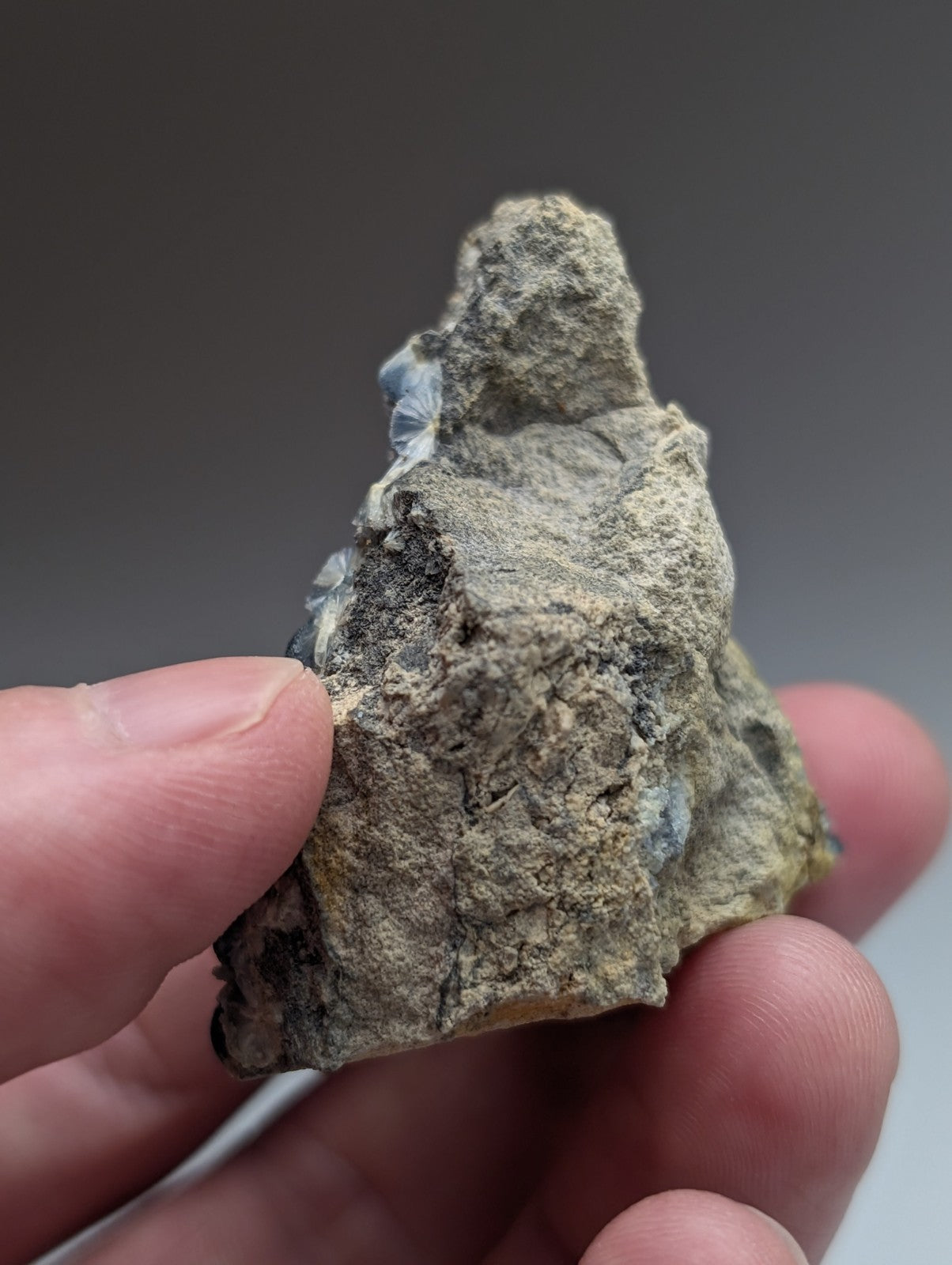 A rough irregular grayish-green blue wavellite mineral with crystalline textures from mauldin mountain arkansas
