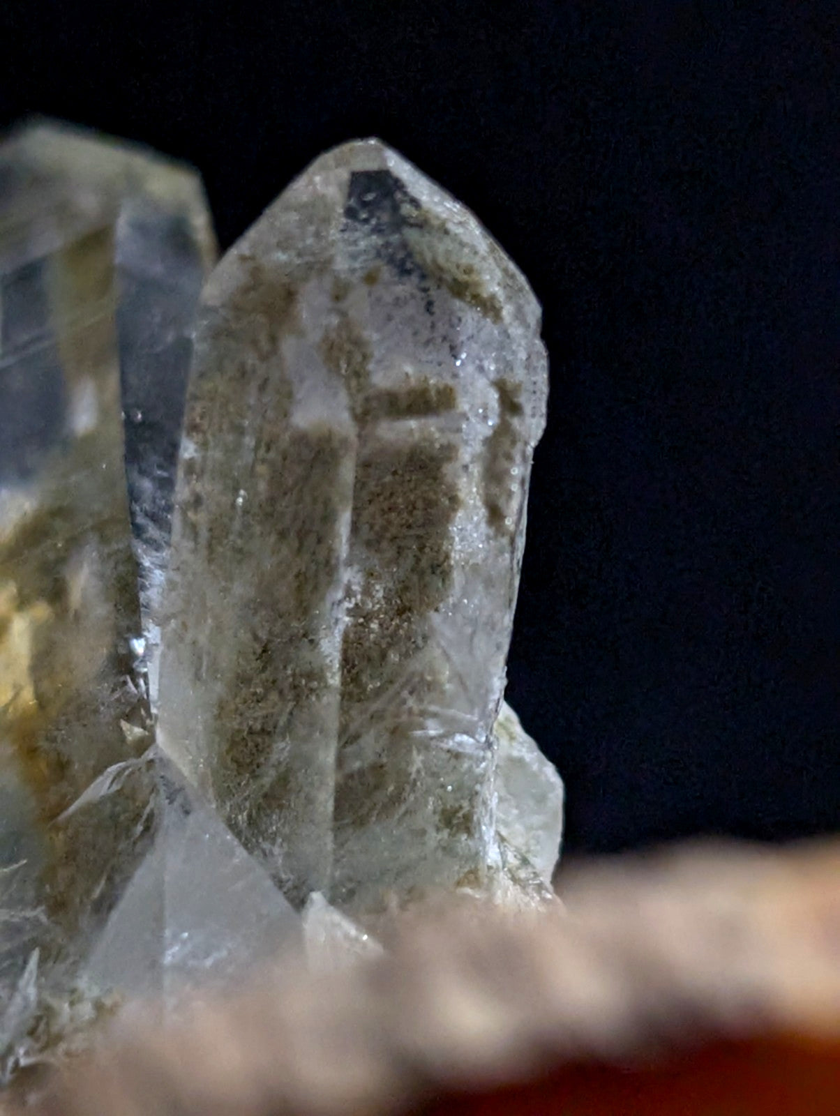 A translucent quartz crystal cluster with a clear, faceted structure and subtle internal inclusions.