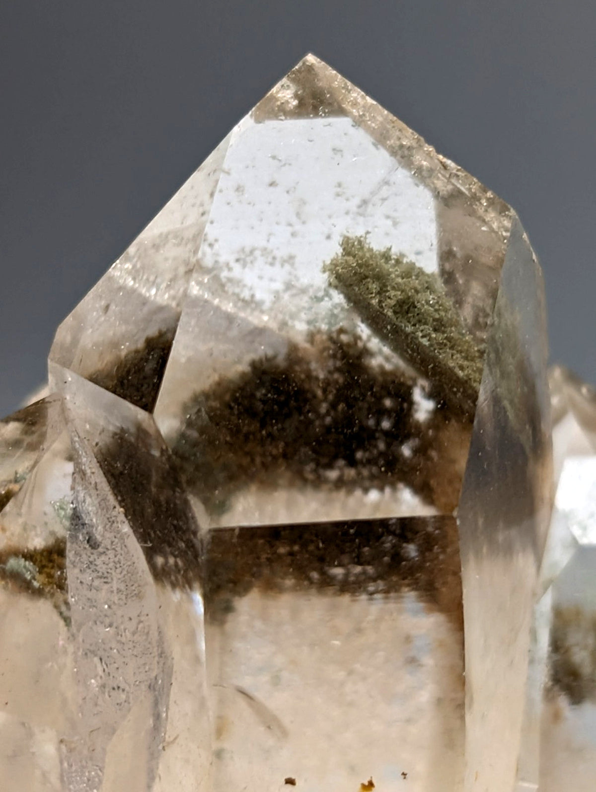 A clear quartz chlorite phantom crystal cluster with natural green and brown inclusions from willis mine arkansas