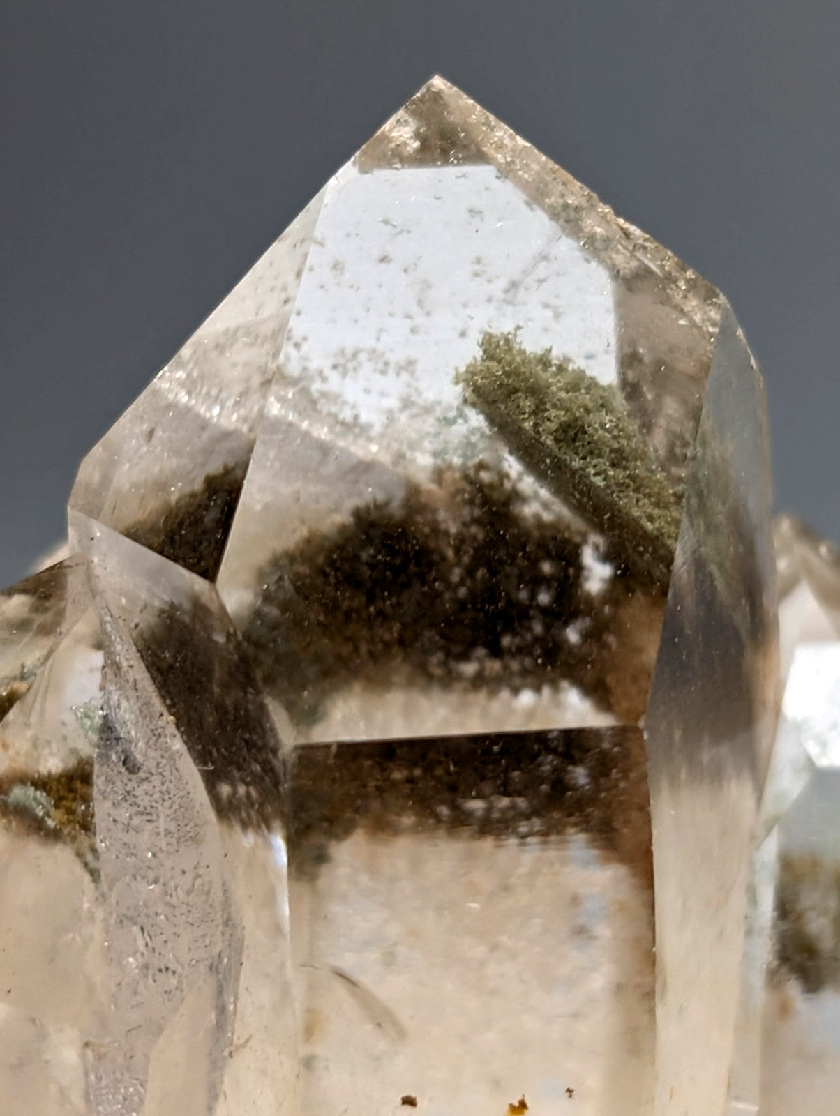 A clear quartz chlorite phantom crystal cluster with natural green and brown inclusions from willis mine arkansas