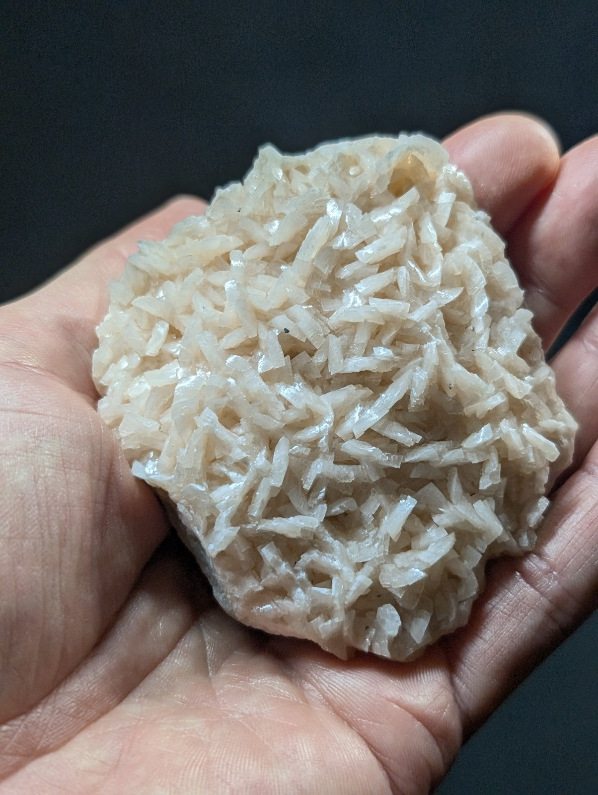 A translucent, pale white mineral specimen with a crystalline texture and irregularly shaped facets.
