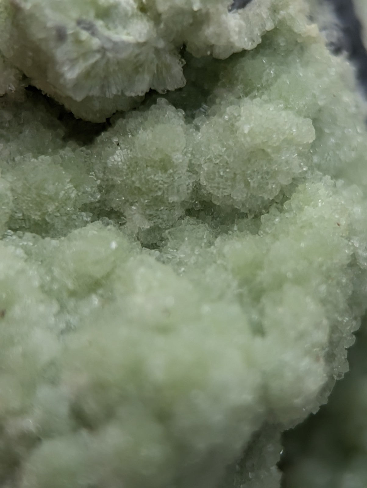 A cluster of pale green fluorwavellite crystalline mineral formations intermixed with sio2 from mauldin mountain arkansas