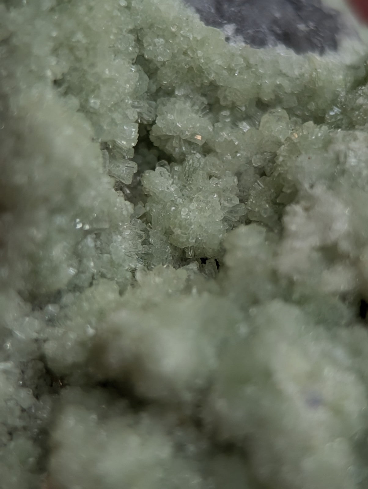 A cluster of translucent pale green fluorwavellite crystals intermixed with sio2 from mauldin mountain arkansas