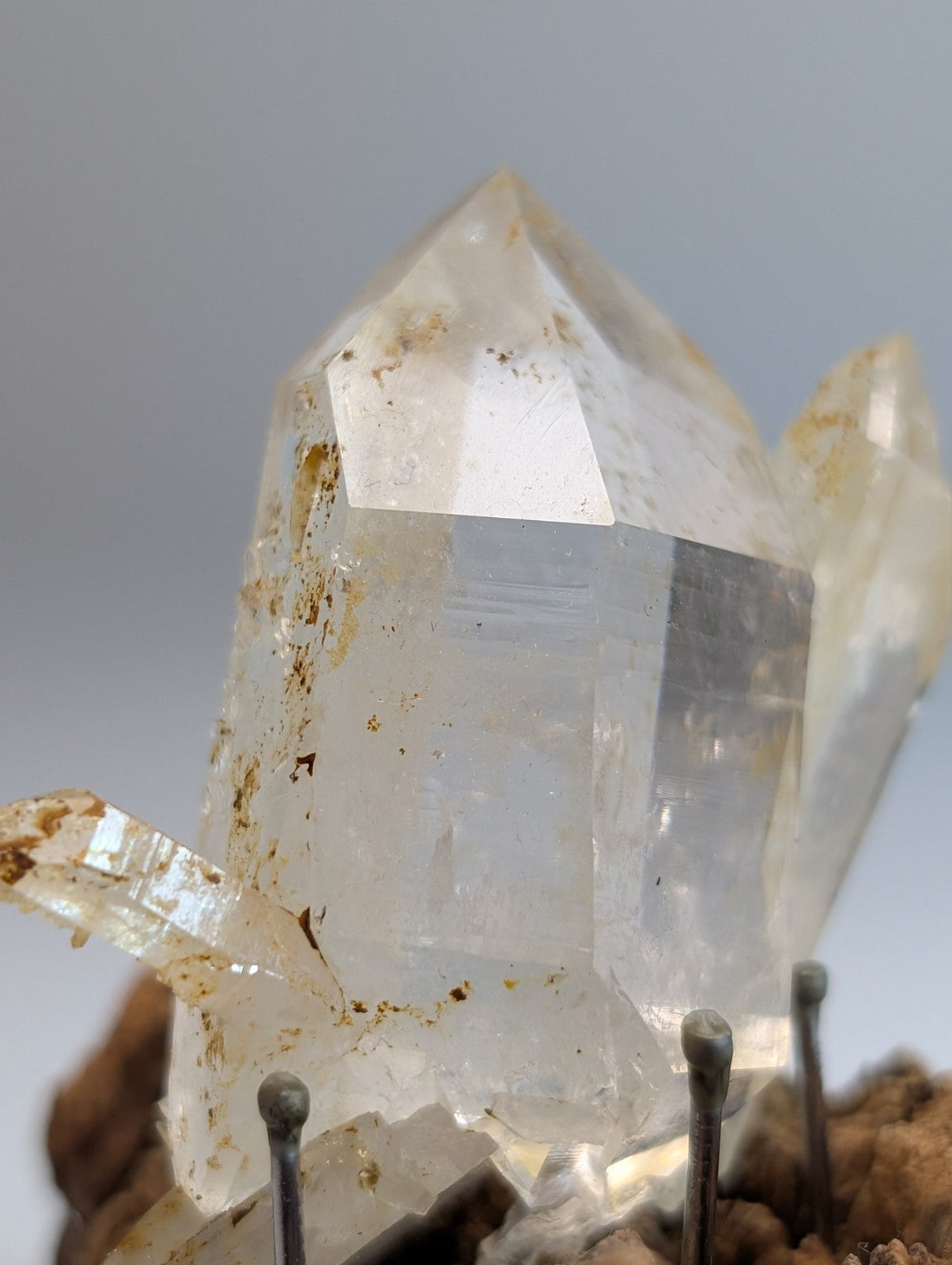 A plus museum grade clear quartz crystal cluster with sharp facets and subtle yellowish inclusions on a wood mount from garland county arkansas