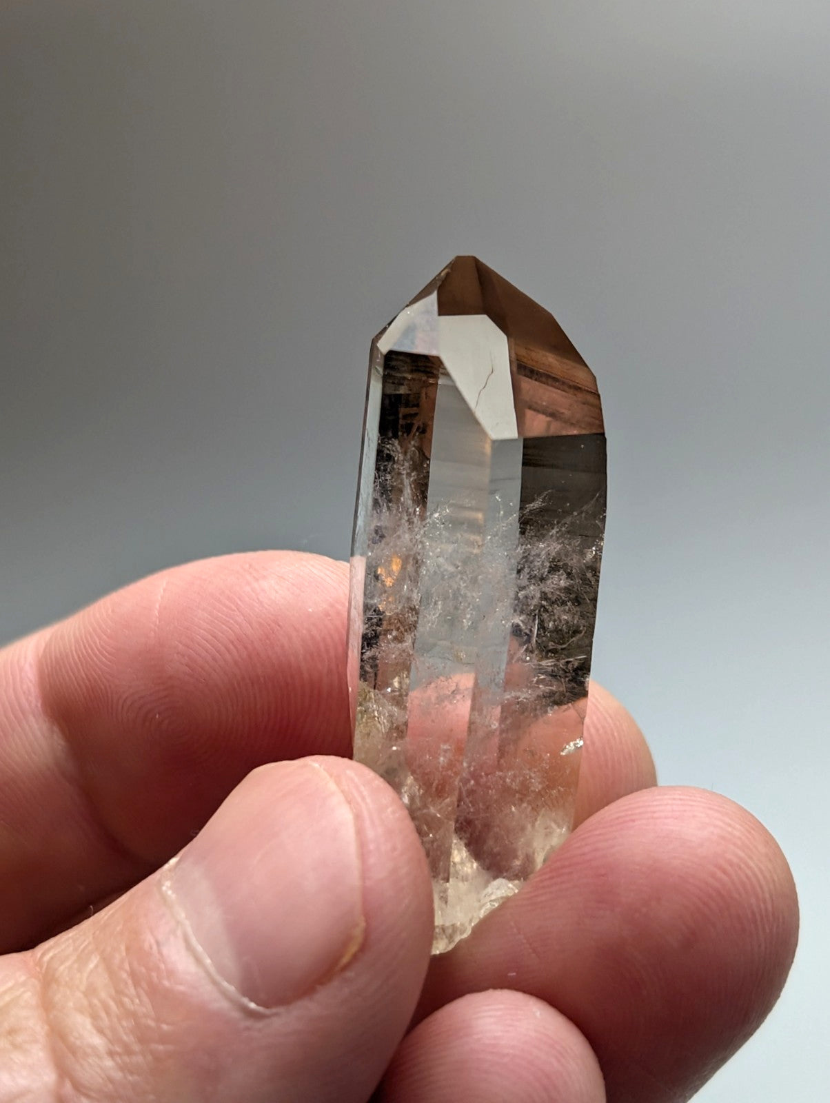 A+++ natural smoky quartz crystal point with translucent brownish color and internal inclusions from Garland County Arkansas USA