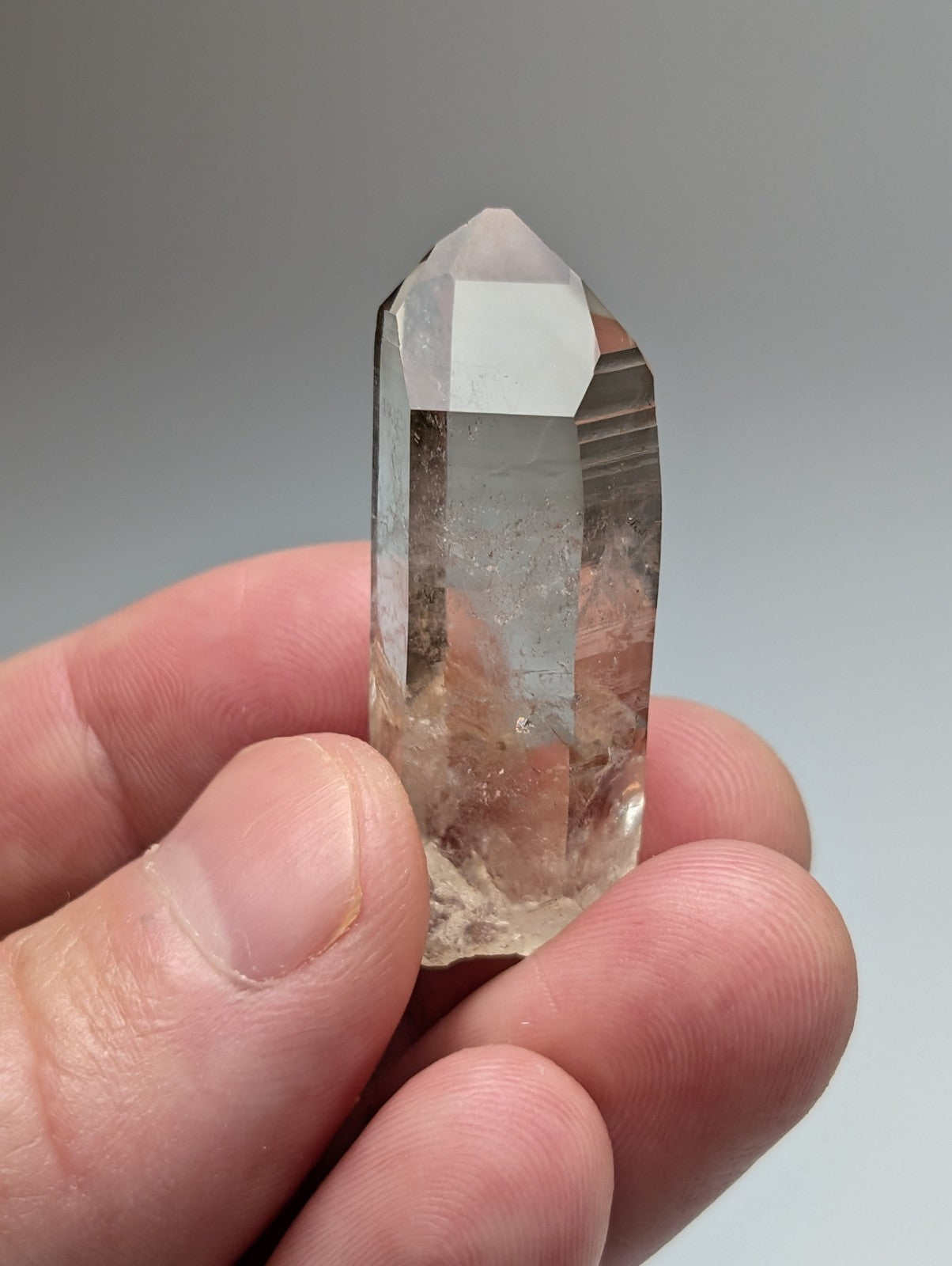 A+++ natural smoky quartz crystal point with translucent light brown hue and natural inclusions from garland county arkansas usa