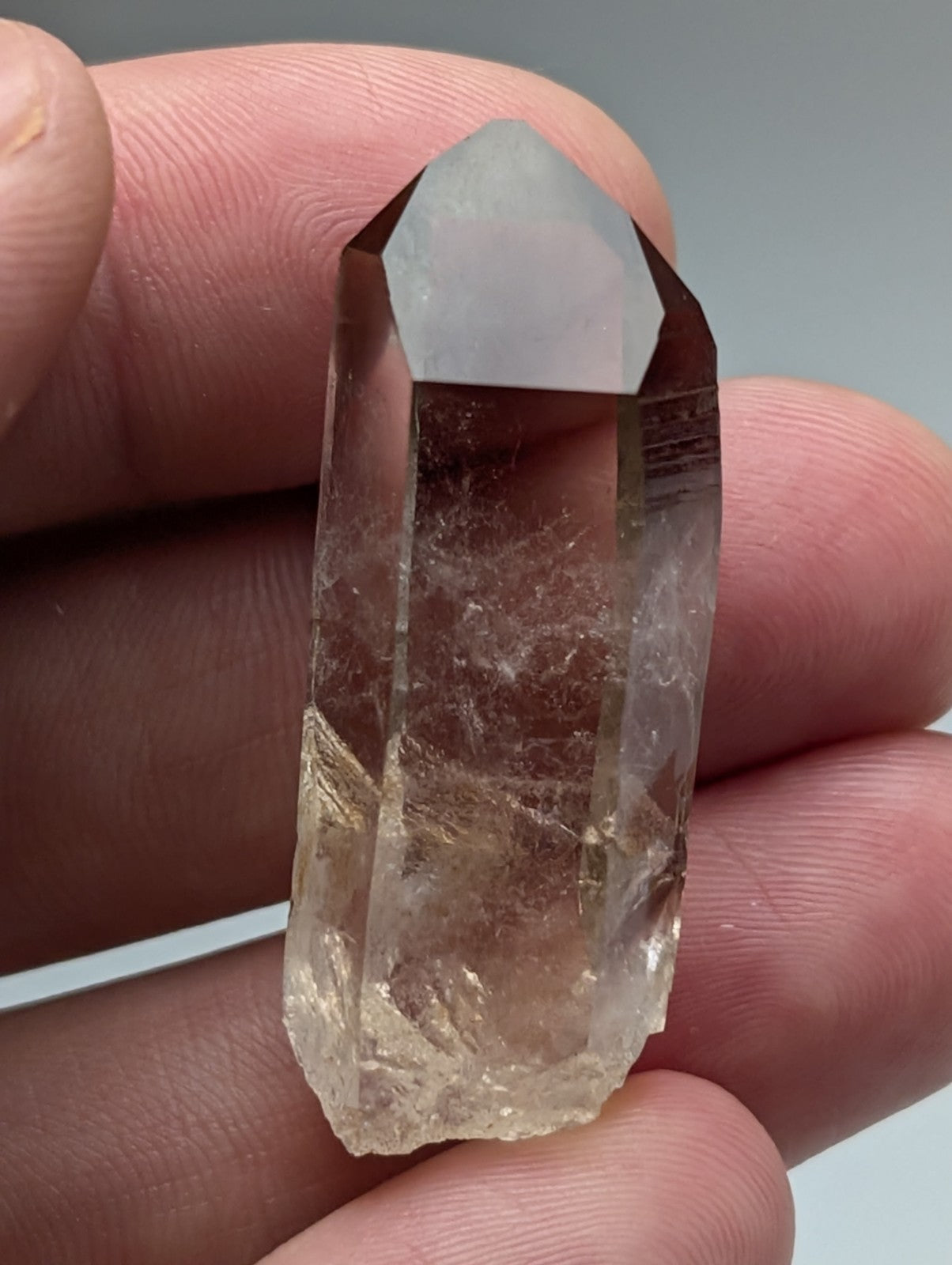 A+++ natural smoky quartz crystal point in translucent amber hue with pointed top and natural facets from garland county arkansas usa