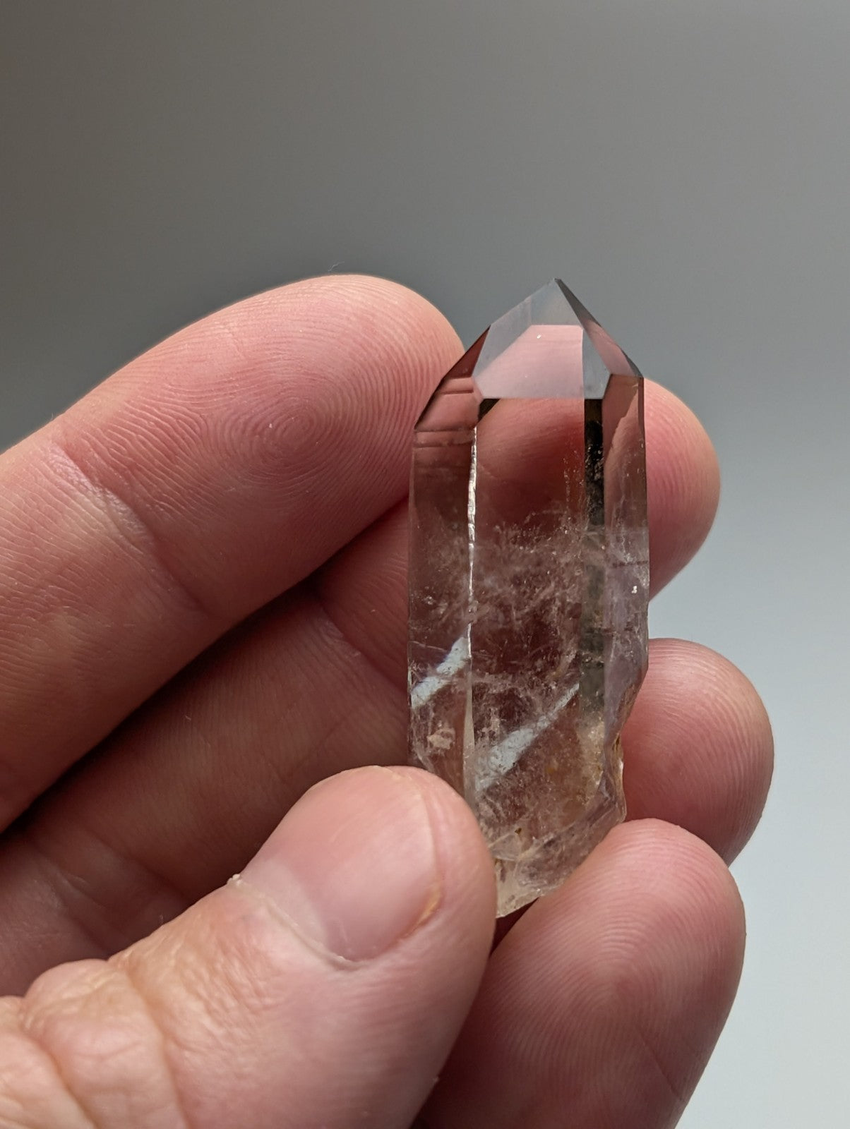 A+++ natural smoky quartz crystal point with a translucent pointed top and natural internal inclusions from arkansas usa