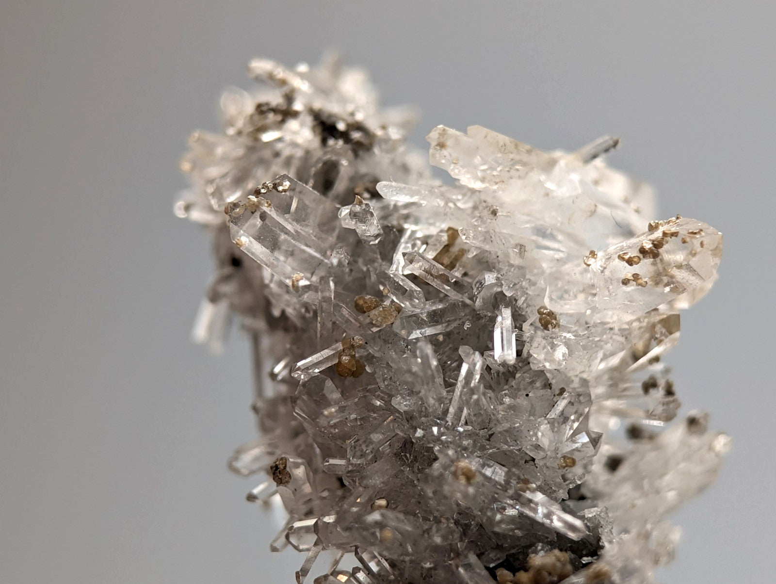 A cluster of translucent quartz crystals with grayish inclusions from jeffrey quarry arkansas rare a++++ solution quartz