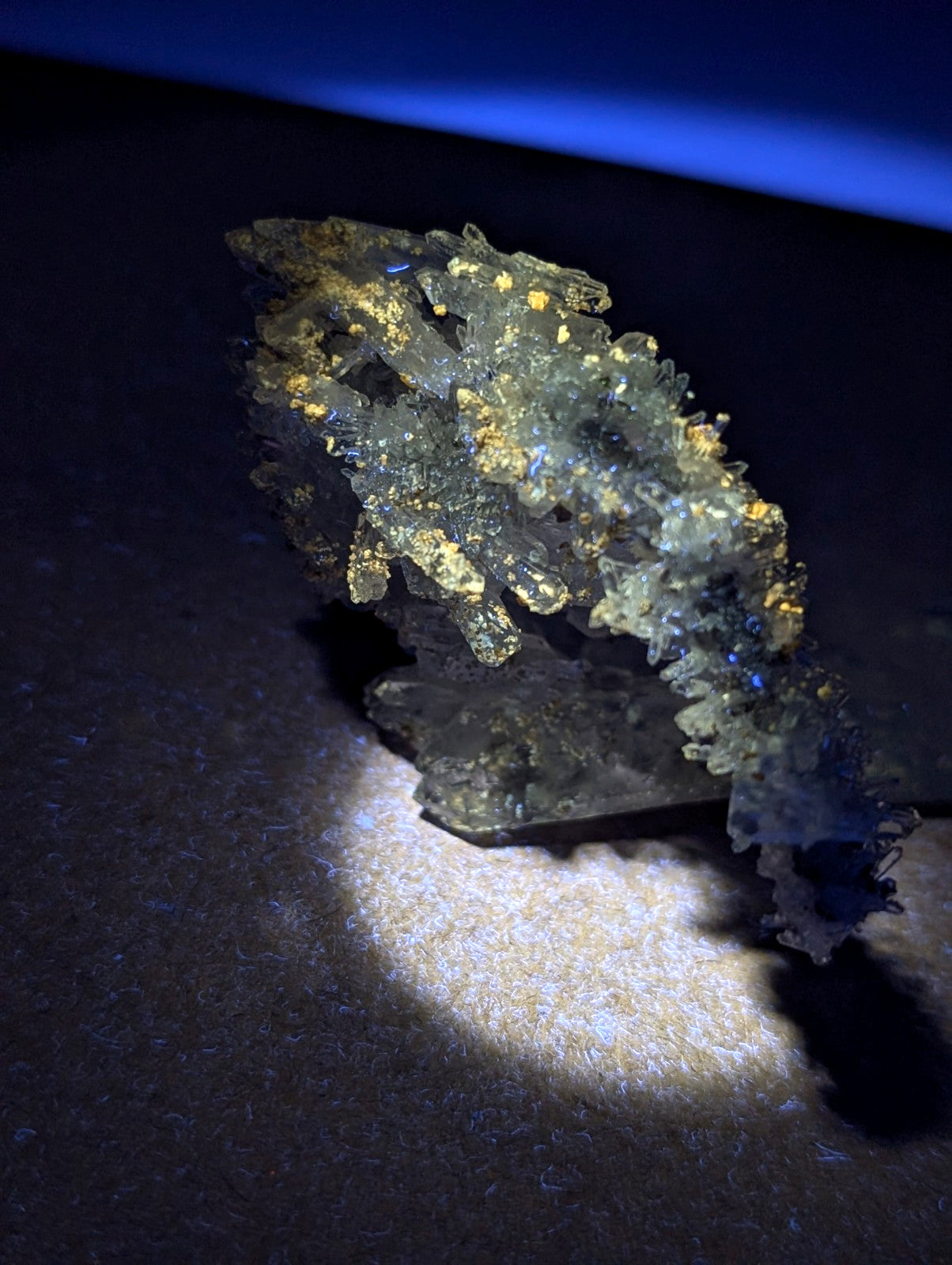 A translucent crystalline solution quartz with golden uv reactive cookeite inclusions from jeffrey quarry arkansas rare specimen
