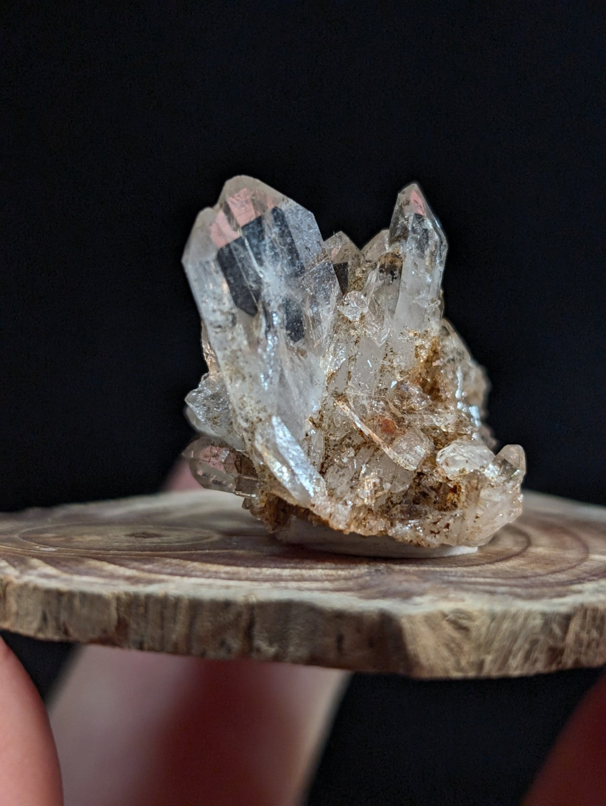 A+ tabby quartz crystal cluster with sharp faceted clear quartz points and pinkish hues on a rough earthy base