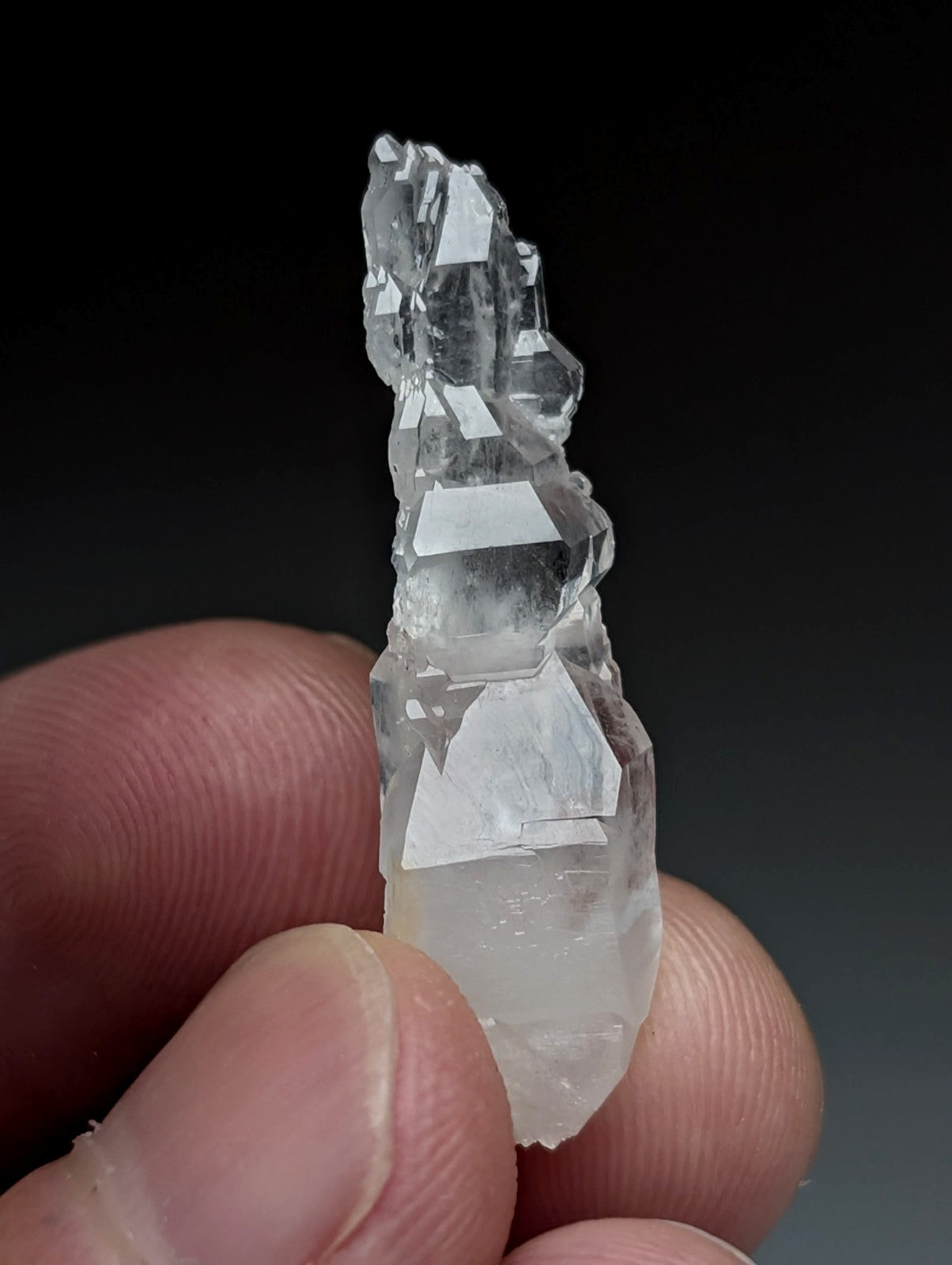 A translucent quartz crystal cluster with sharp facets and a milky base from garland county arkansas usa