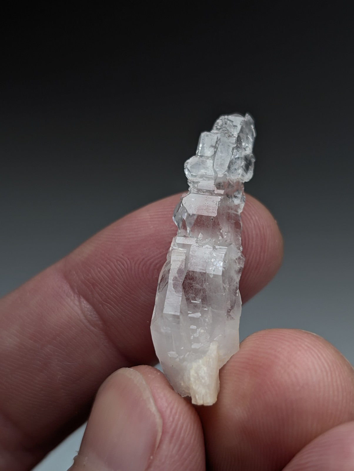 A translucent clear quartz crystal cluster with faceted geometric structure from garland county arkansas usa