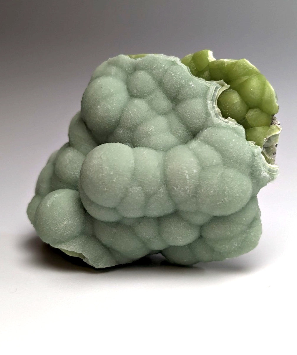 Amazing A+++ wavellite mineral specimen from Mauldin Mountain Arkansas with textured pale green bubble surface and exposed interior