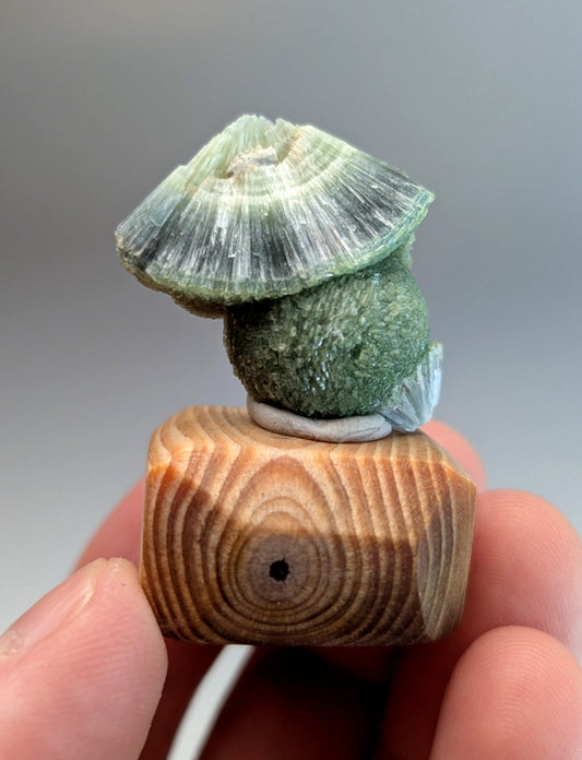 Handcrafted green mossy wavellite figurine with translucent layered cap on handmade wood mount from Garland County Arkansas