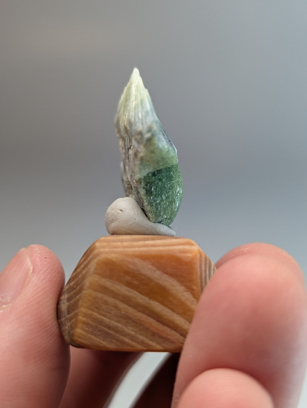 Amazing wavellite mineral specimen with green and white crystalline tip on handmade tan wood mount from Arkansas
