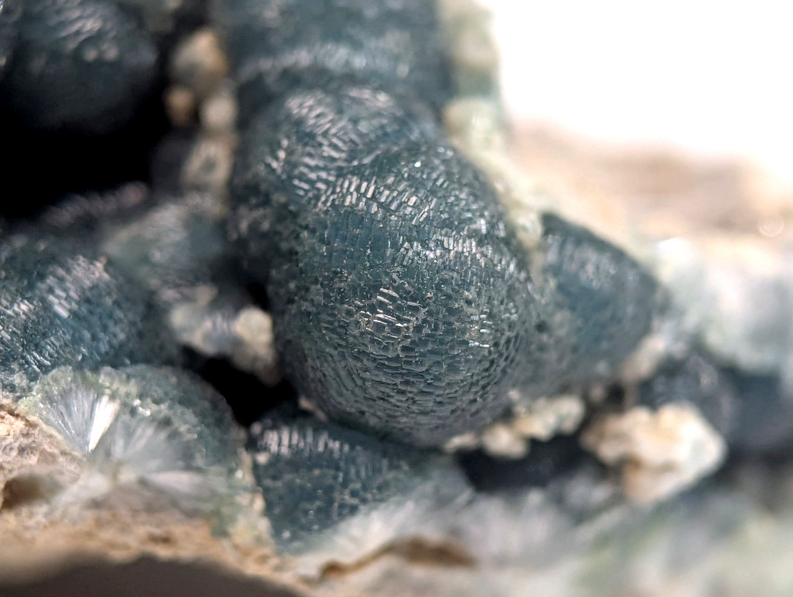 Dark blue, textured mineral formations with a crystalline surface.