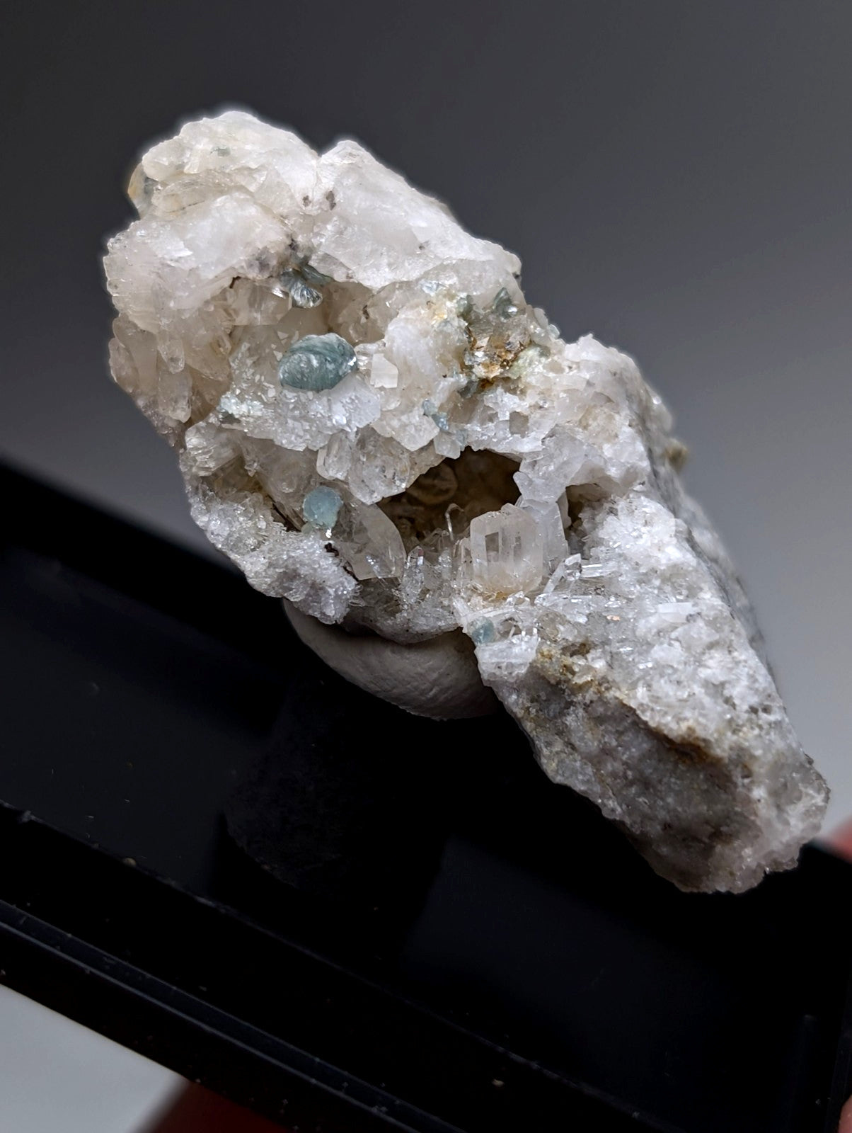Translucent white quartz crystal with blue green cookeite inclusions from saline county arkansas old stock uv reactive