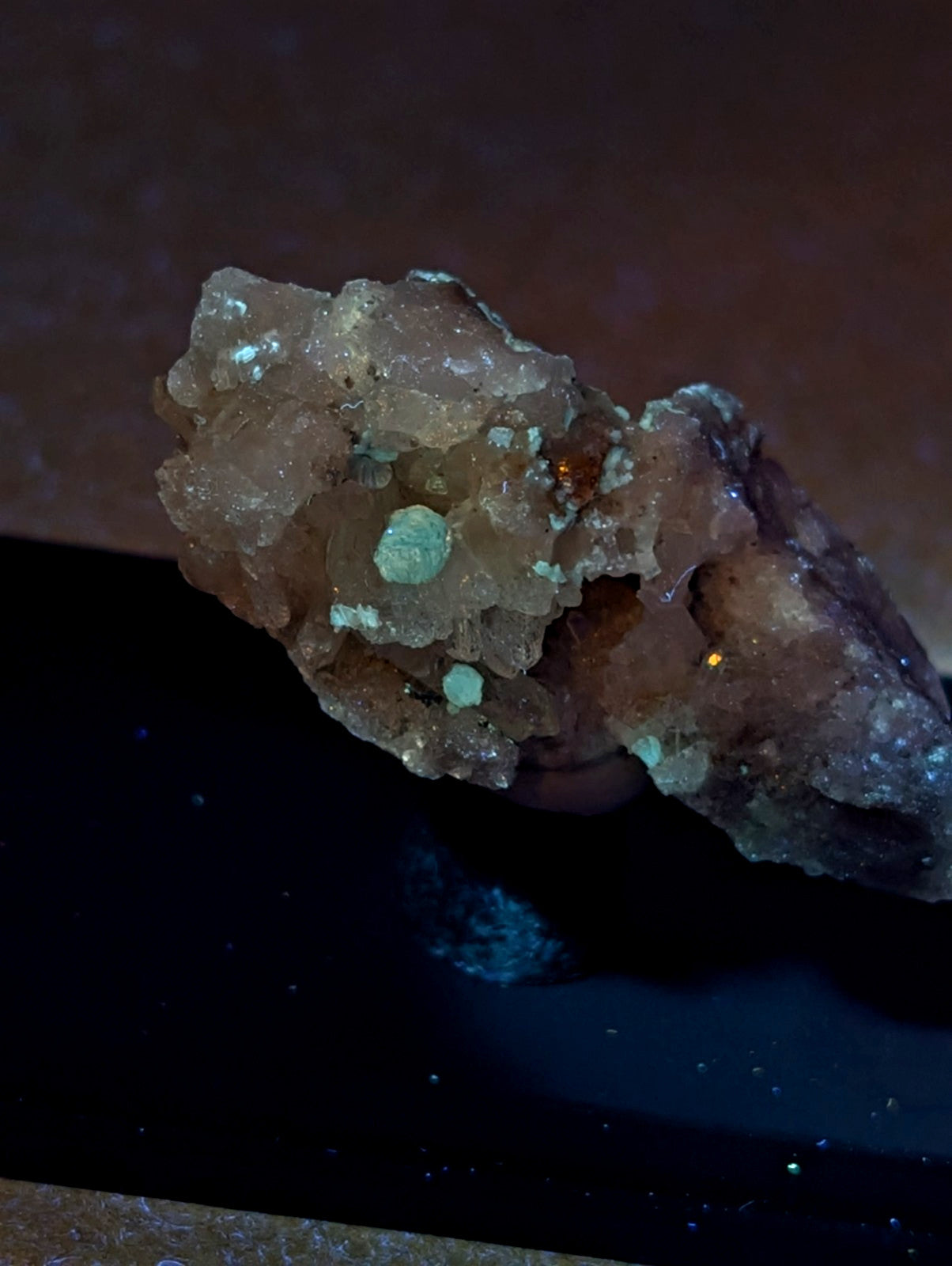 Blue-green cookeite on quartz mineral specimen with rough translucent brownish green crystals from Saline County Arkansas