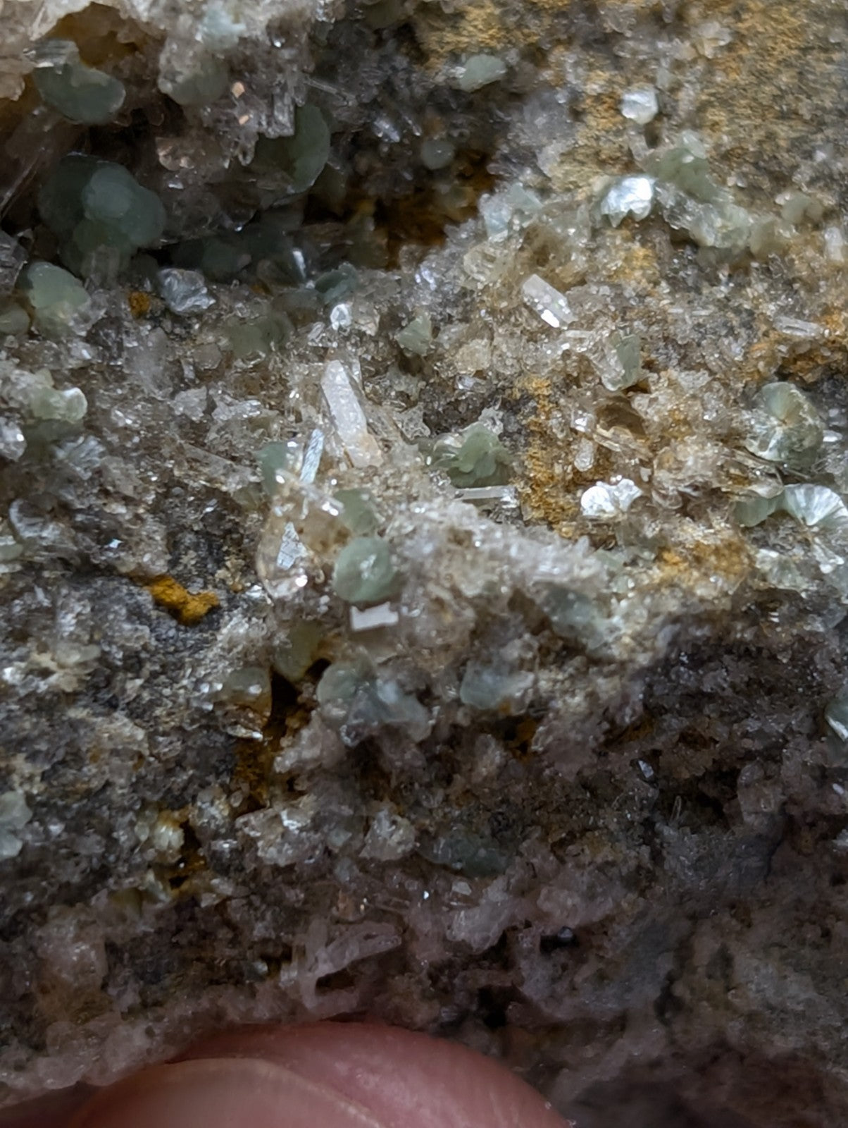 A cluster of blue green cookeite crystals on quartz with yellow and gray matrix from saline county arkansas rare uv reactive