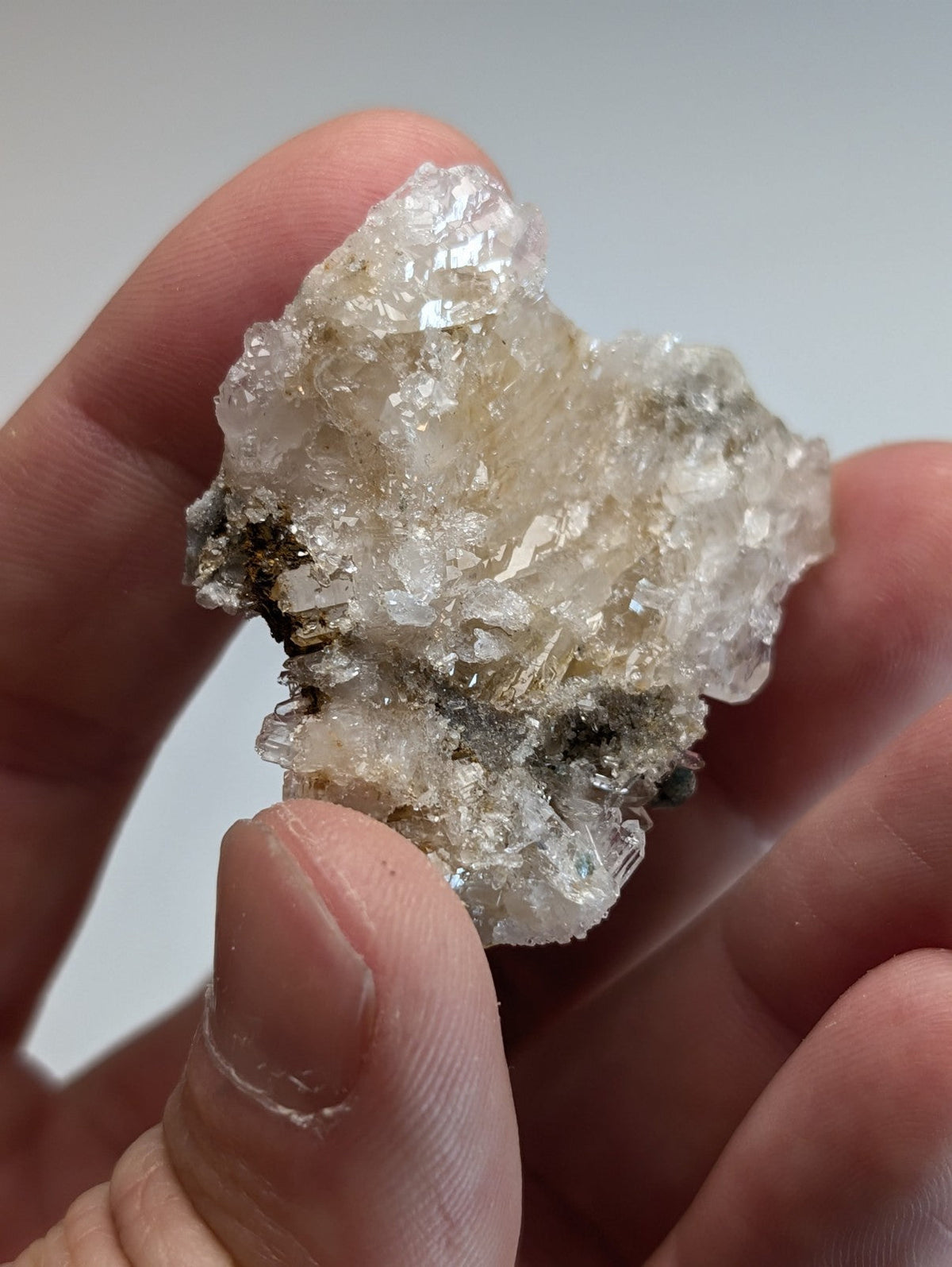 A translucent blue green cookeite on quartz specimen with rough surface and golden yellow inclusions from arkansas
