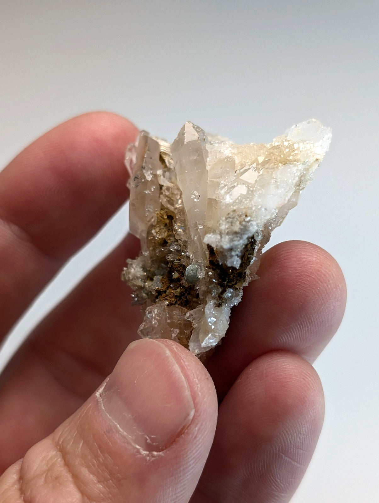 Blue green cookeite on quartz mineral with translucent white and dark greenish brown matrix from saline county arkansas