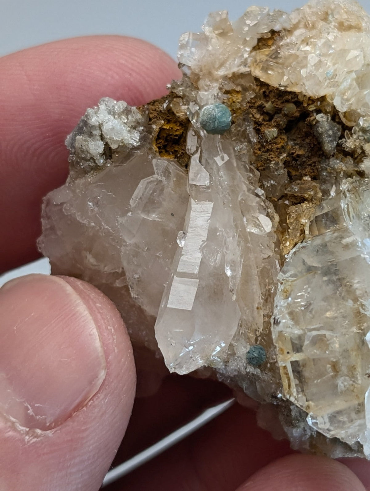 A translucent quartz crystal cluster with blue green cookeite inclusions from saline county Arkansas rare uv reactive