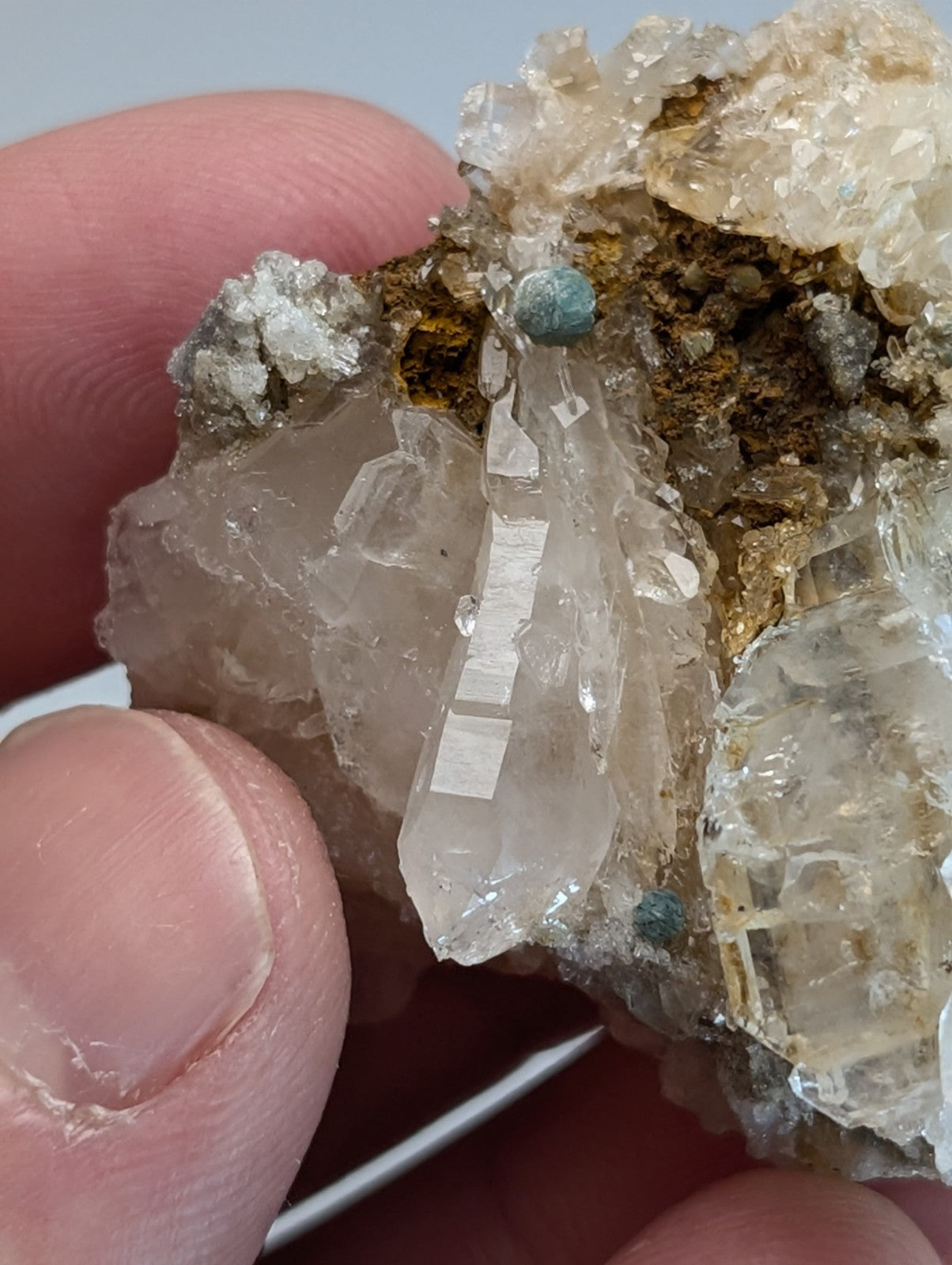 A translucent quartz crystal cluster with blue green cookeite inclusions from saline county Arkansas rare uv reactive
