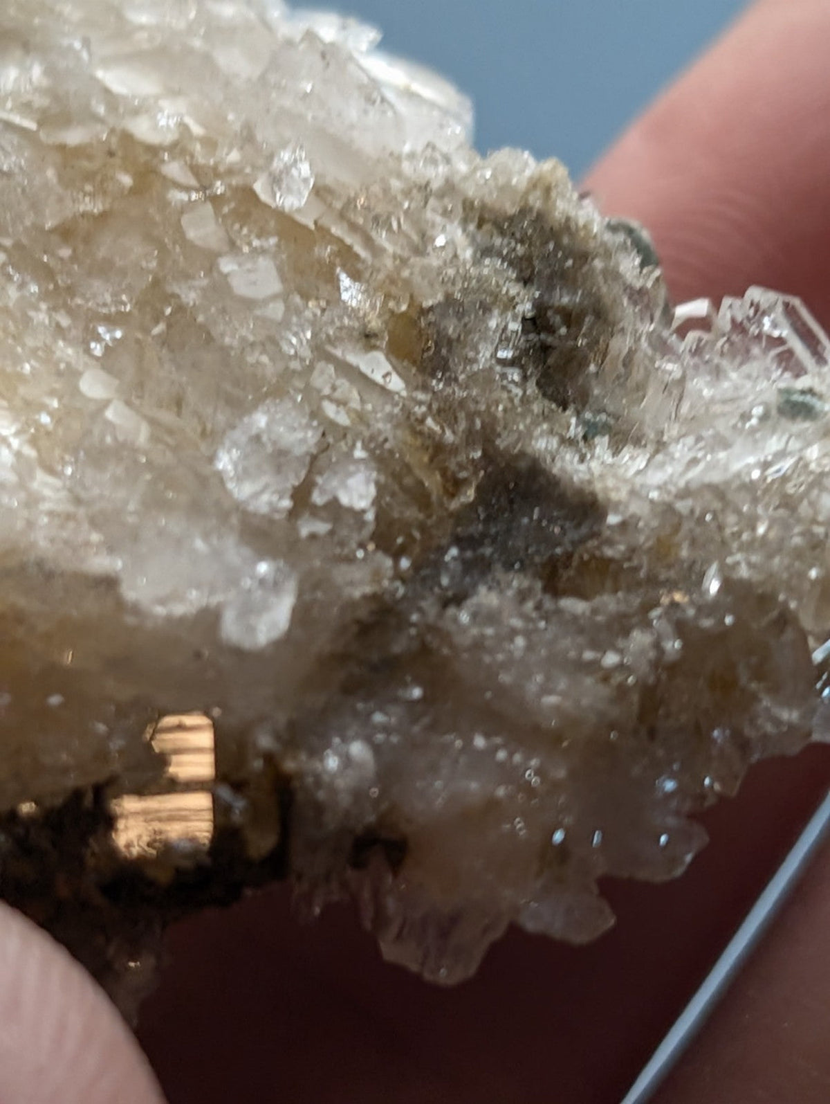 A translucent blue green cookeite on quartz mineral with clear and cloudy patches from saline county Arkansas rare uv reactive