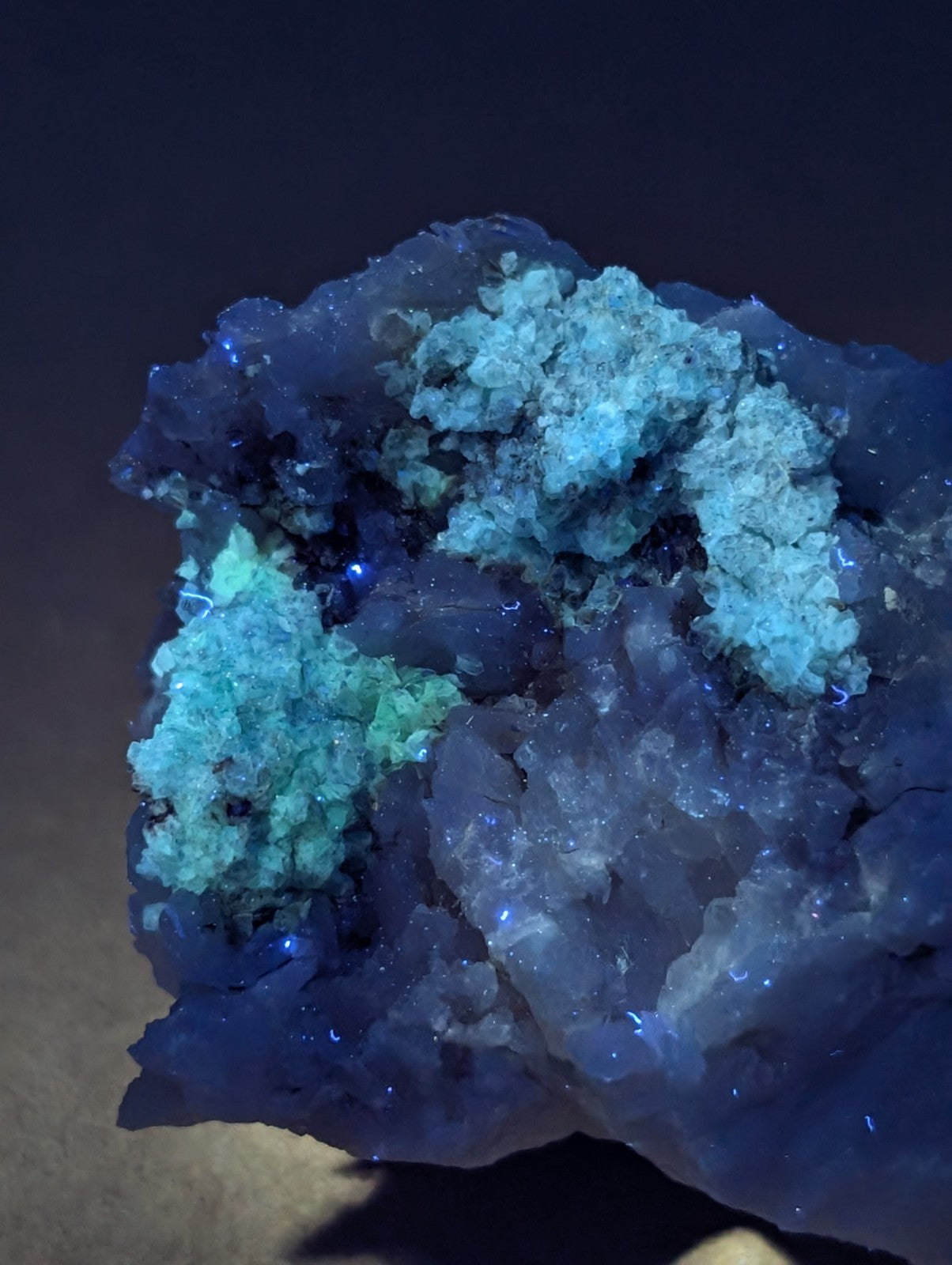A striking blue and turquoise blue green cookeite on quartz mineral specimen with crystalline formations from Arkansas