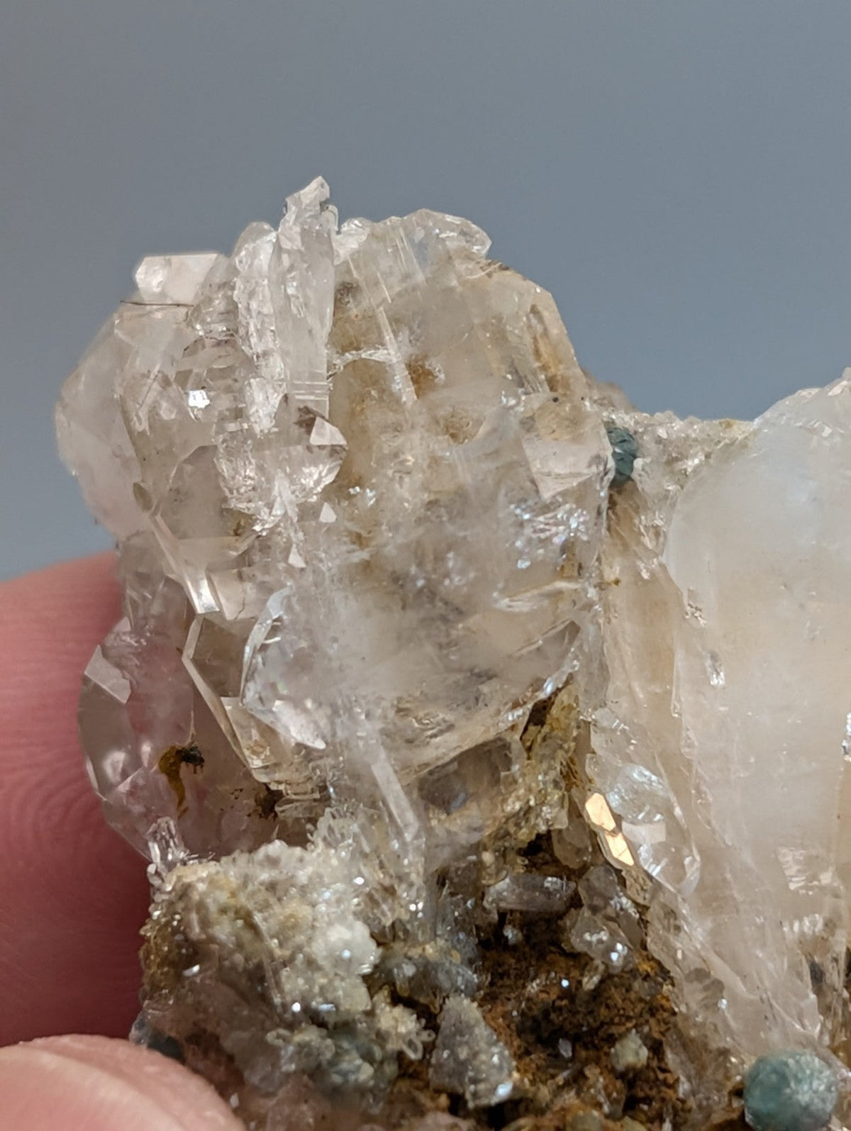 Blue green cookeite on translucent quartz with clear facets on rough matrix base from saline county arkansas rare uv reactive