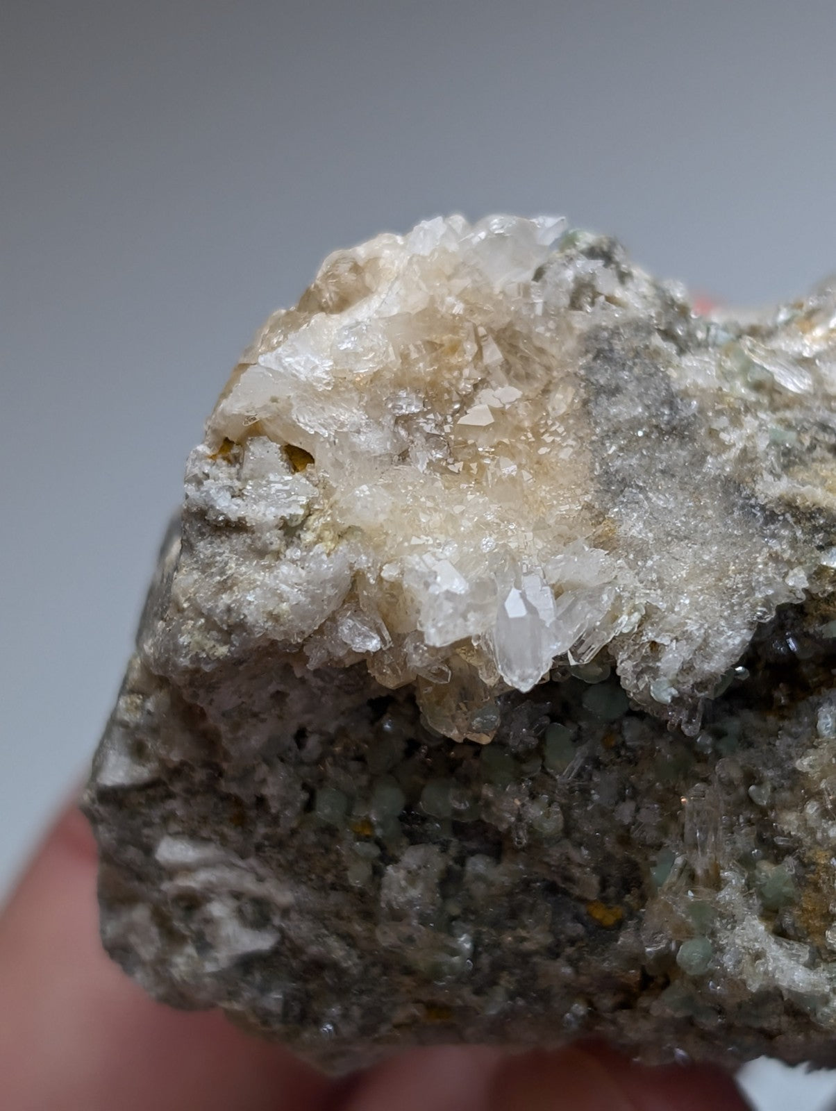 Blue green cookeite on quartz with translucent white crystals on rough gray rock from saline county arkansas rare uv reactive