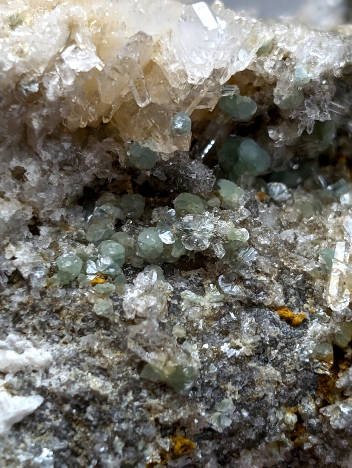 A cluster of translucent light green blue green cookeite crystals on quartz from saline county arkansas rare uv reactive