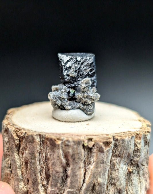 Black and silver mineral specimen.