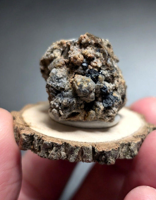 Rough, multi-colored mineral specimen.
