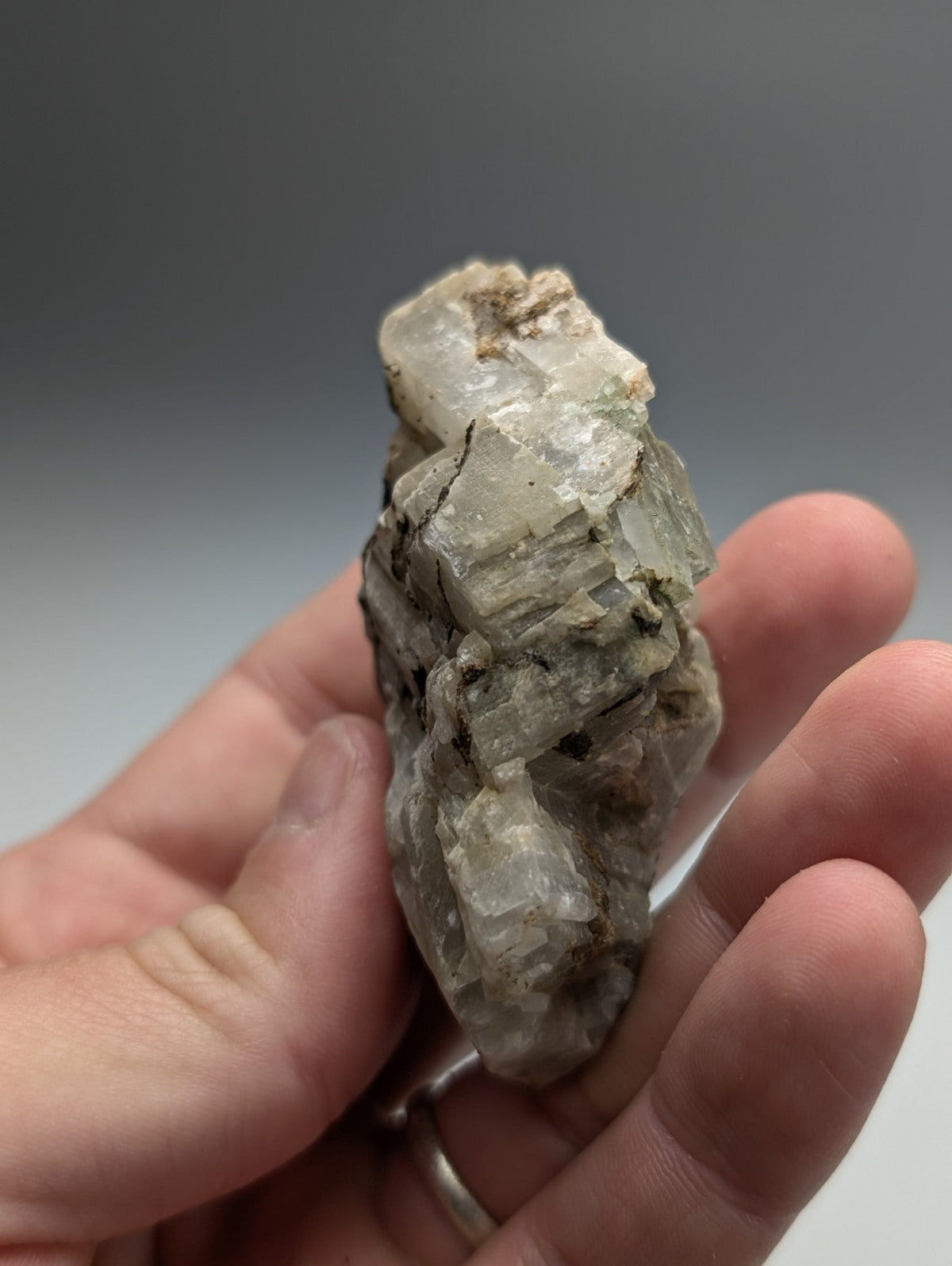 Calcio carbonatite mineral specimen from magnet cove arkansas with pale greenish white crystals and dark inclusions