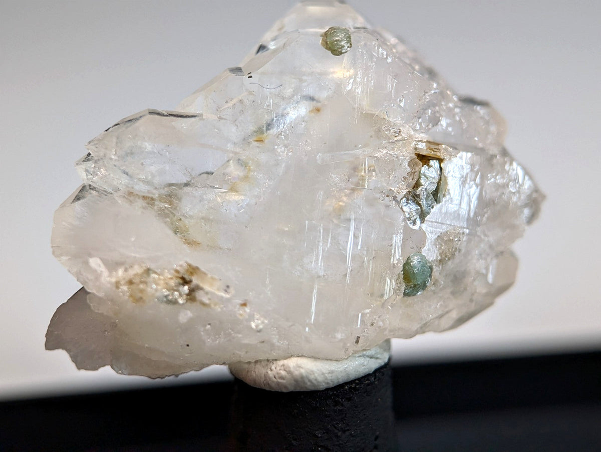 Faden quartz crystal with translucent blue-green uv reactive cookeite and metallic inclusions from Saline County Arkansas