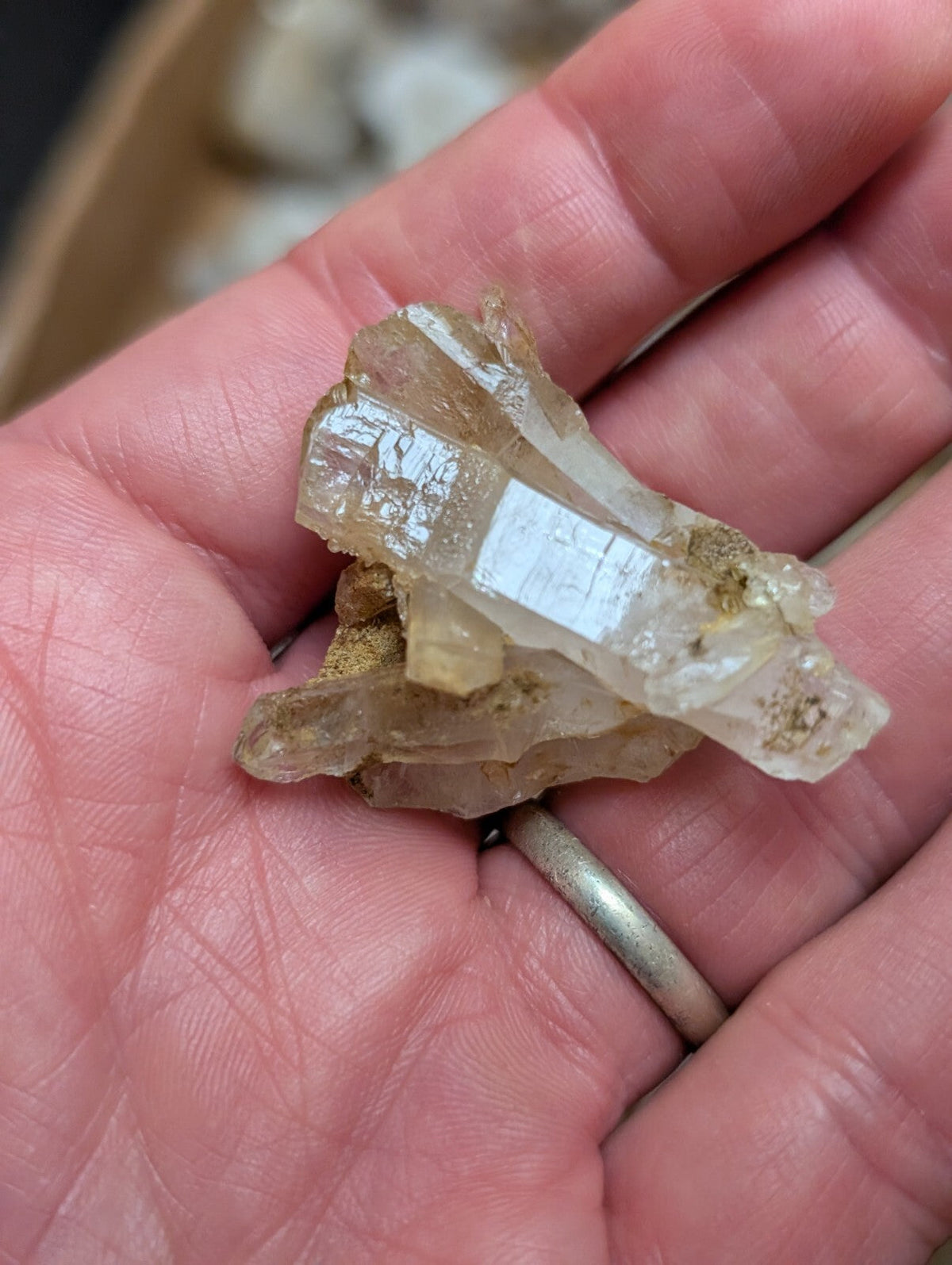 A translucent, pale yellowish quartz crystal cluster with a rough, natural texture and visible internal inclusions.