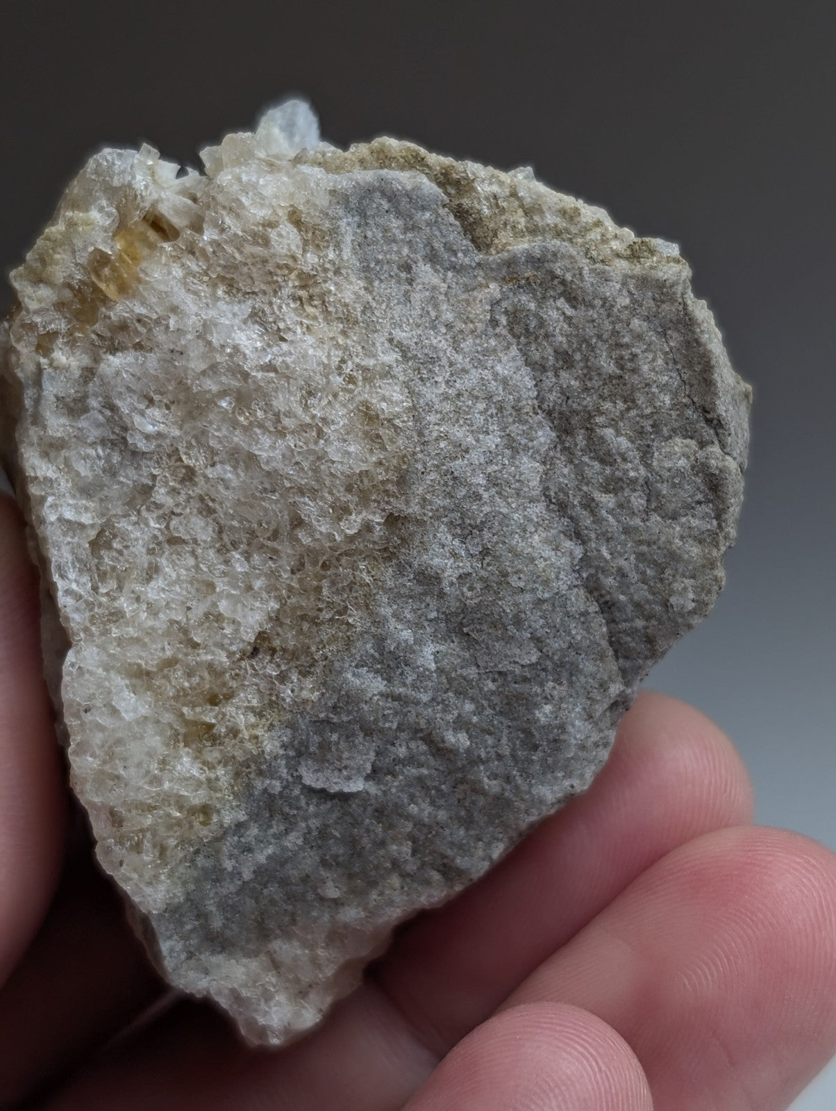 Green cookeite on solution quartz mineral specimen with gray and translucent white crystals from saline county Arkansas