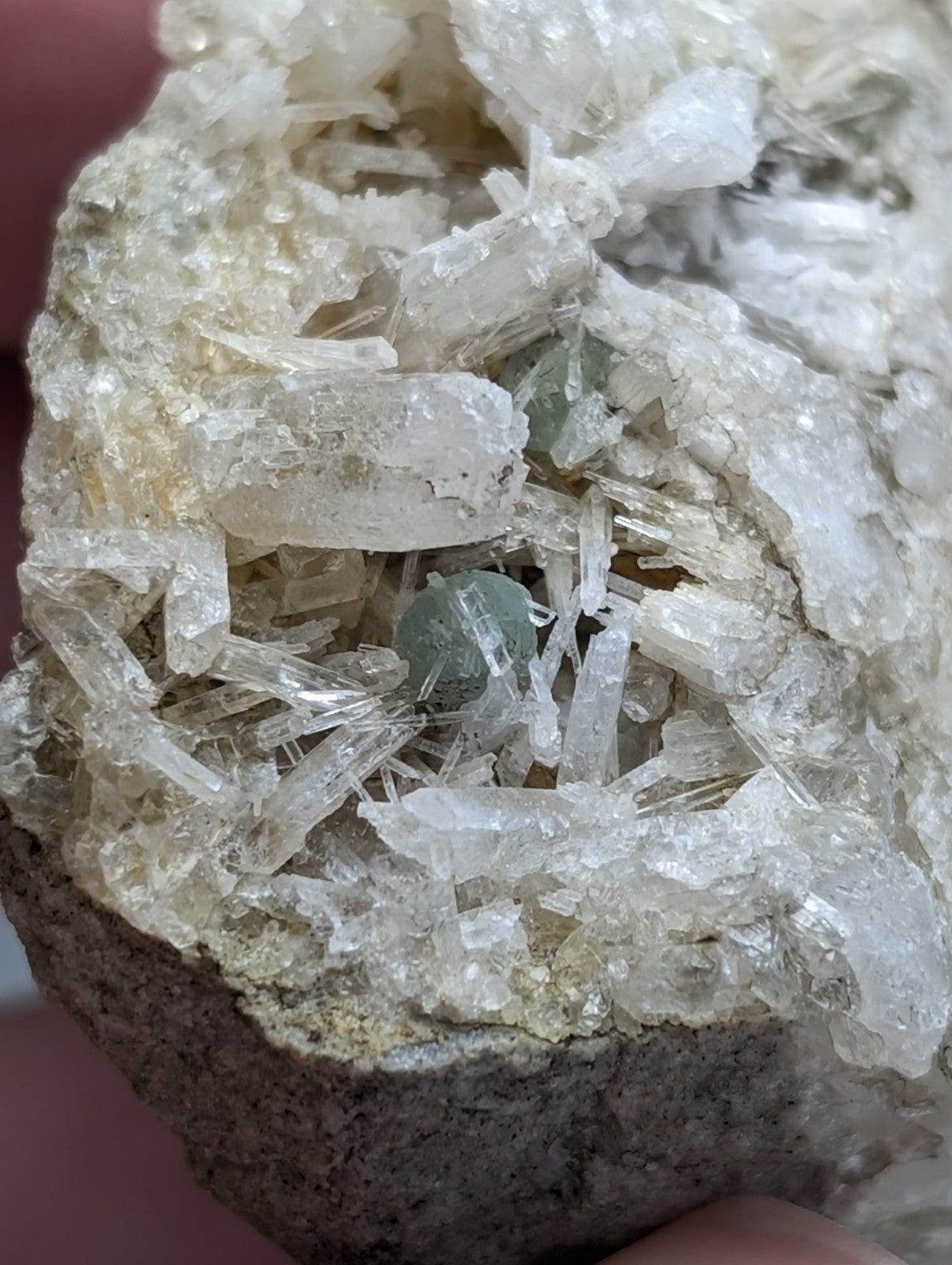 Green cookeite translucent mineral nestled in clear quartz cluster from saline county Arkansas rare UV reactive specimen