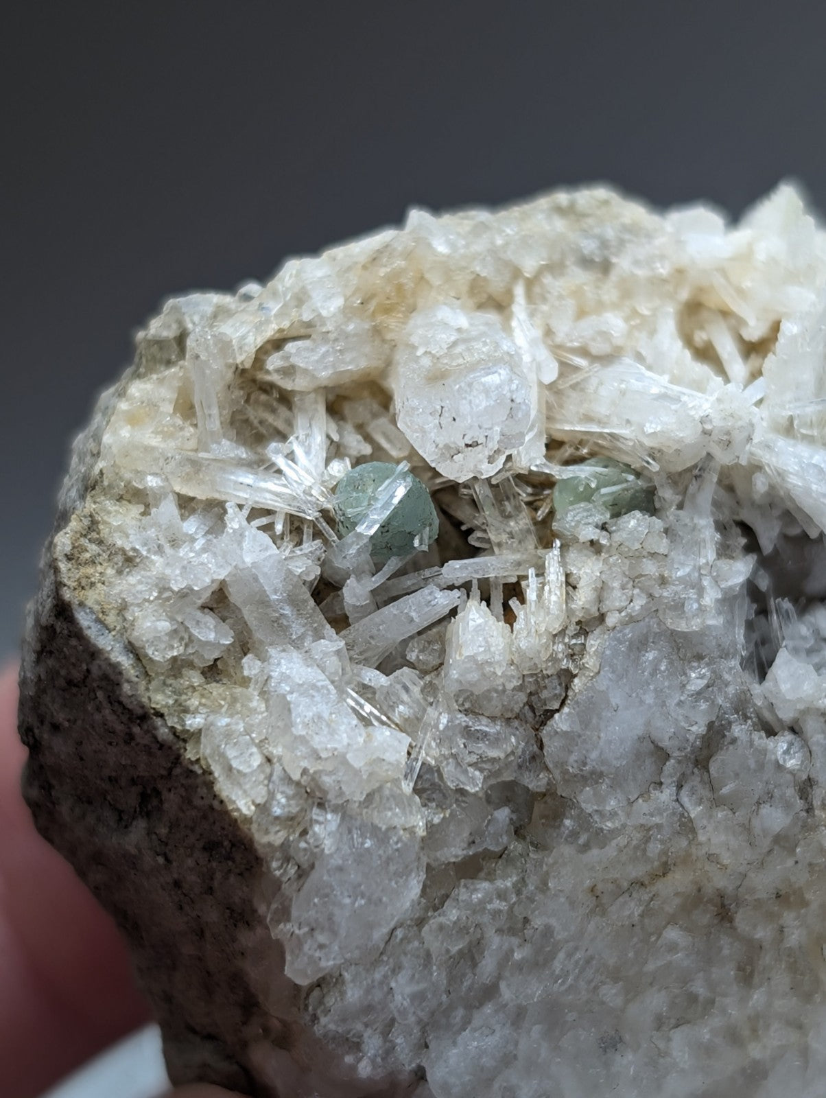 Green cookeite translucent mineral nestled within clear crystalline quartz matrix from saline county arkansas rare uv reactive