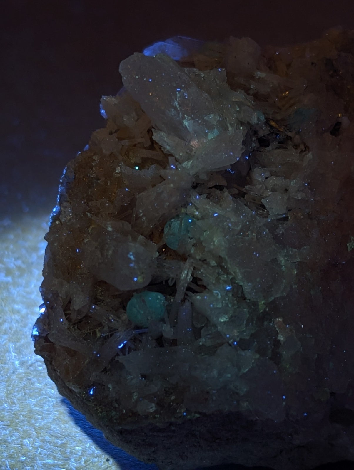 A translucent green cookeite crystalline mineral with clear crystals on earthy brown quartz matrix from arkansas