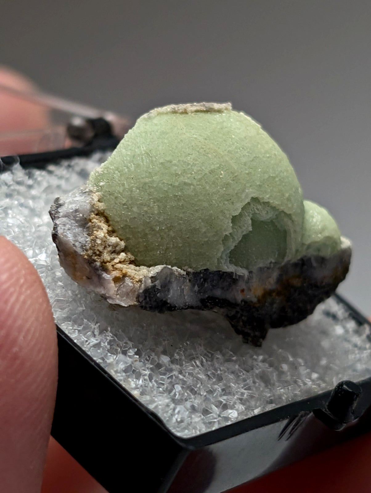 Green wavellite mineral specimen from Mauldin Mountain Arkansas with pale green rough spherical crystal and dark base
