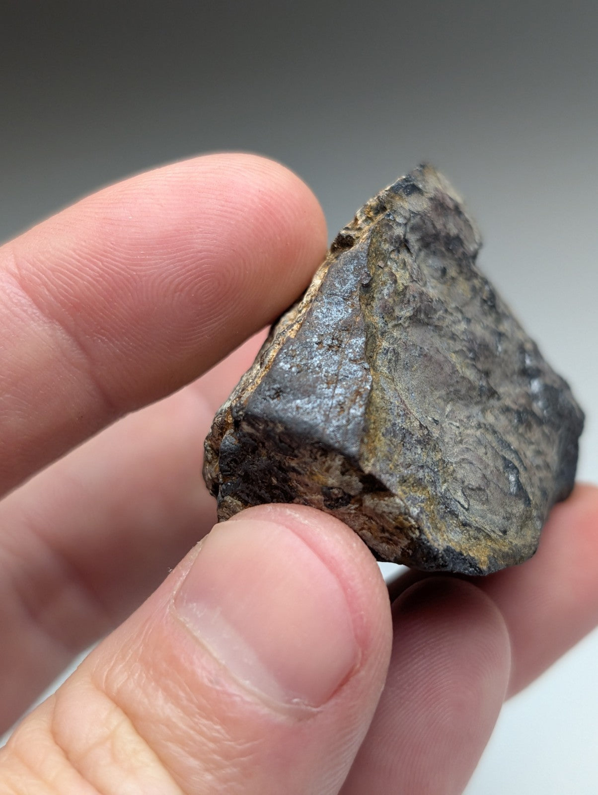 Dark irregular magnetite lodestone fragment with metallic sheen and jagged edges from magnet cove arkansas unique natural magnet