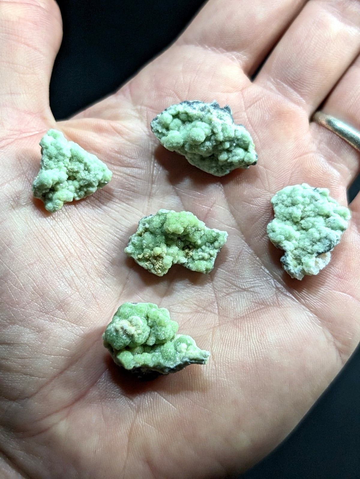 Light green, textured mineral specimens with a slightly rough and uneven surface.