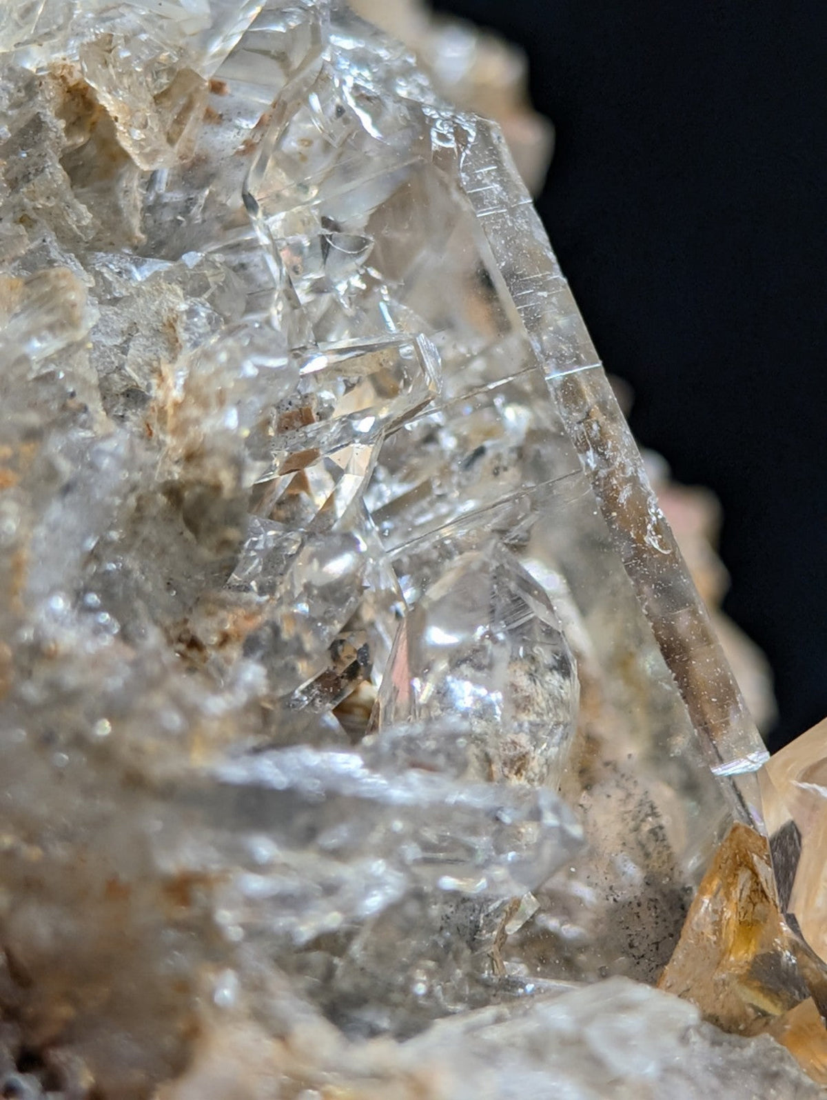 Clear quartz crystals with sharp, faceted edges and a translucent quality.